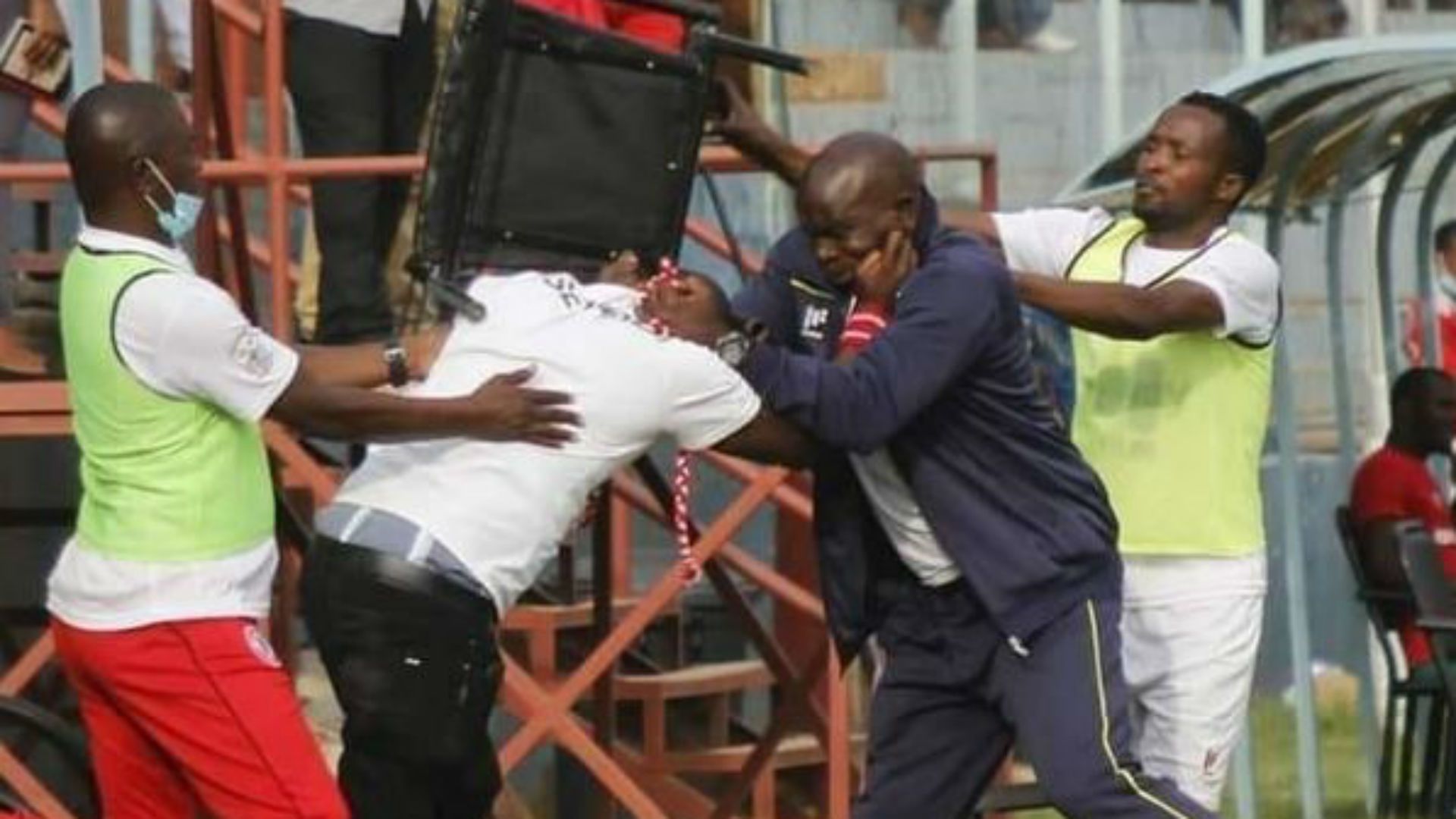Nkana fan invade the pitch.