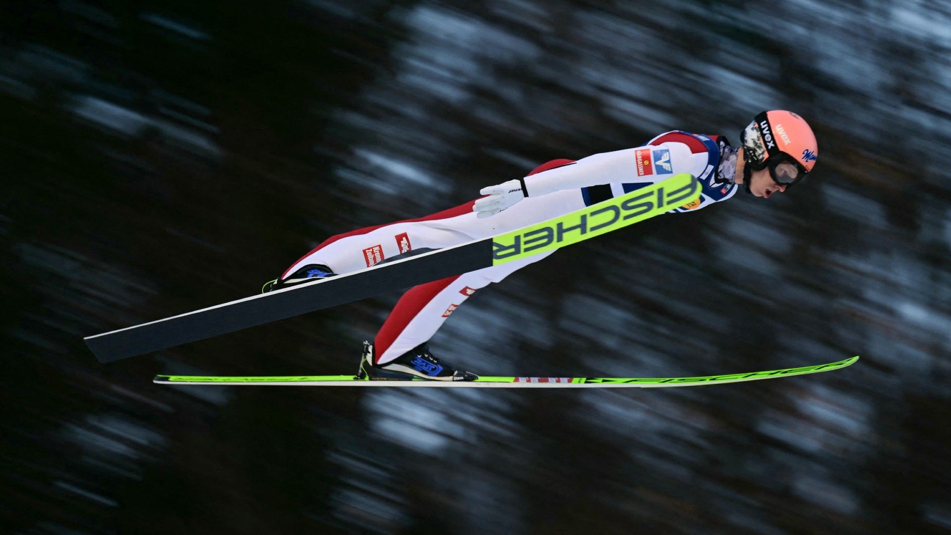  Austria's Daniel Tschofenig soars through the air 