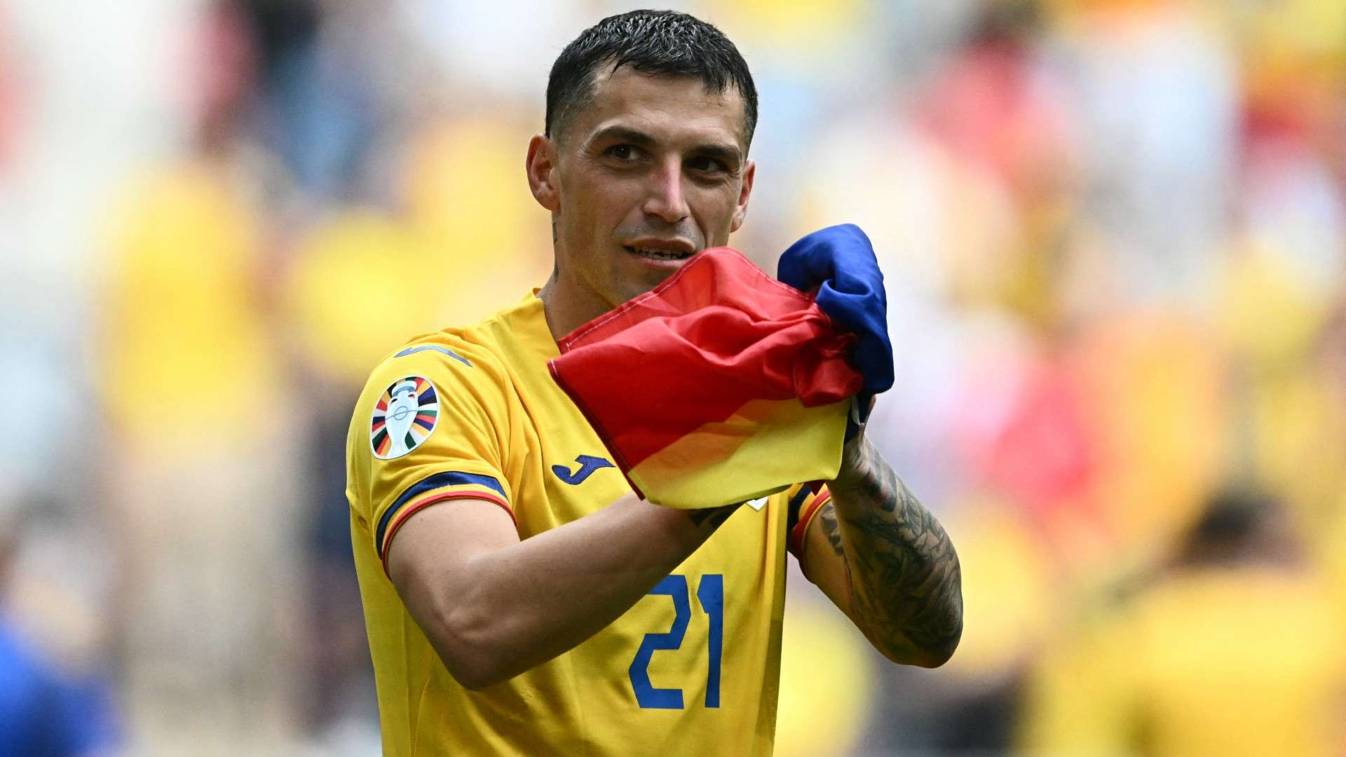 Romania's midfielder #21 Nicolae Stanciu celebrates
