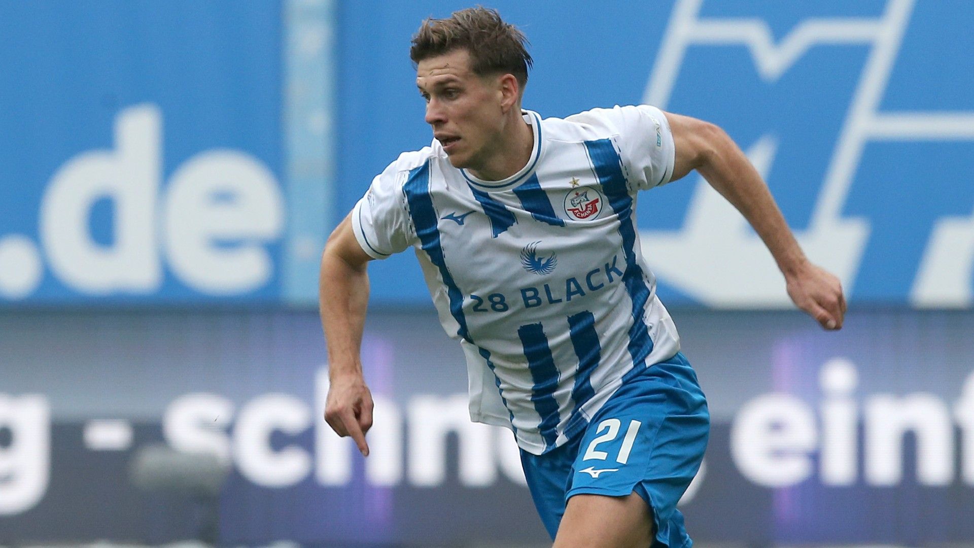Alexander Rossipal of Rostock runs with the ball 