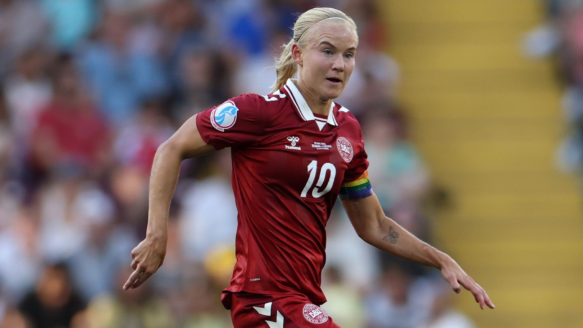 Pernille Harder of Denmark runs with the ball