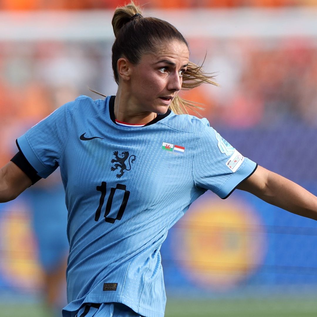Danielle van de Donk of the Netherlands runs with the ball