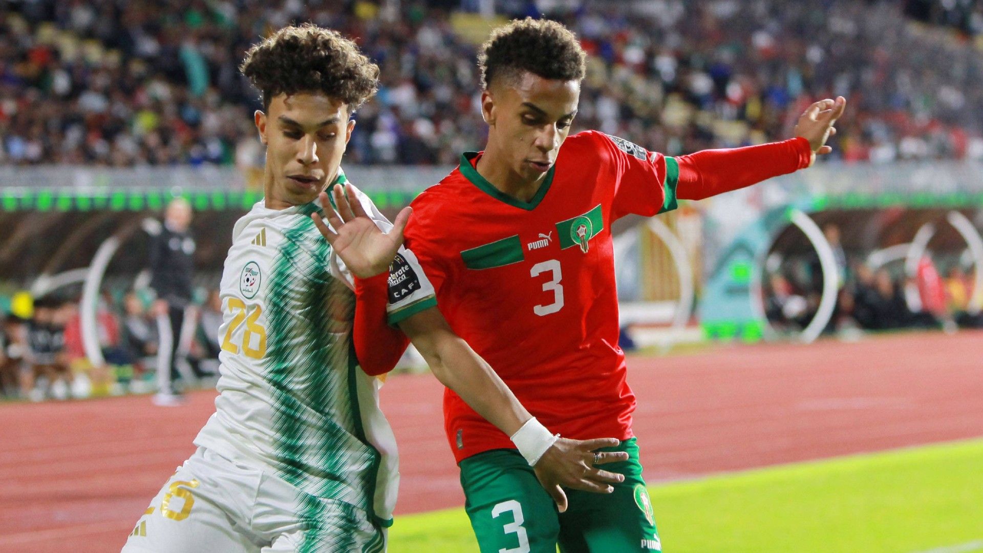 Algerian Fethi Kessassi (L) vies with Moroccan Fouad Zahouani (R)