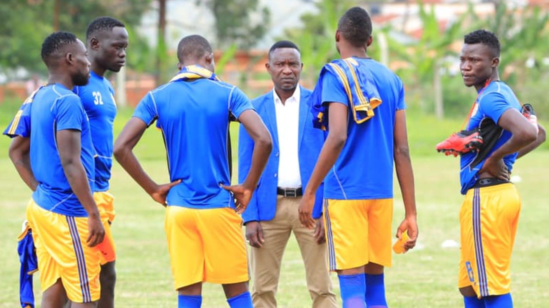 Morley Byekwaso of KCCA FC with players.