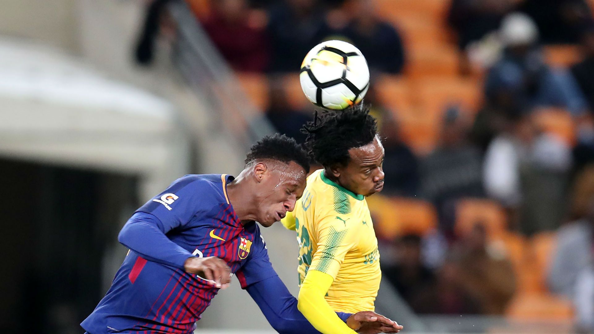 Yerry Mina of Barcelona and Percy Tau of Mamelodi Sundowns - May 16 2018