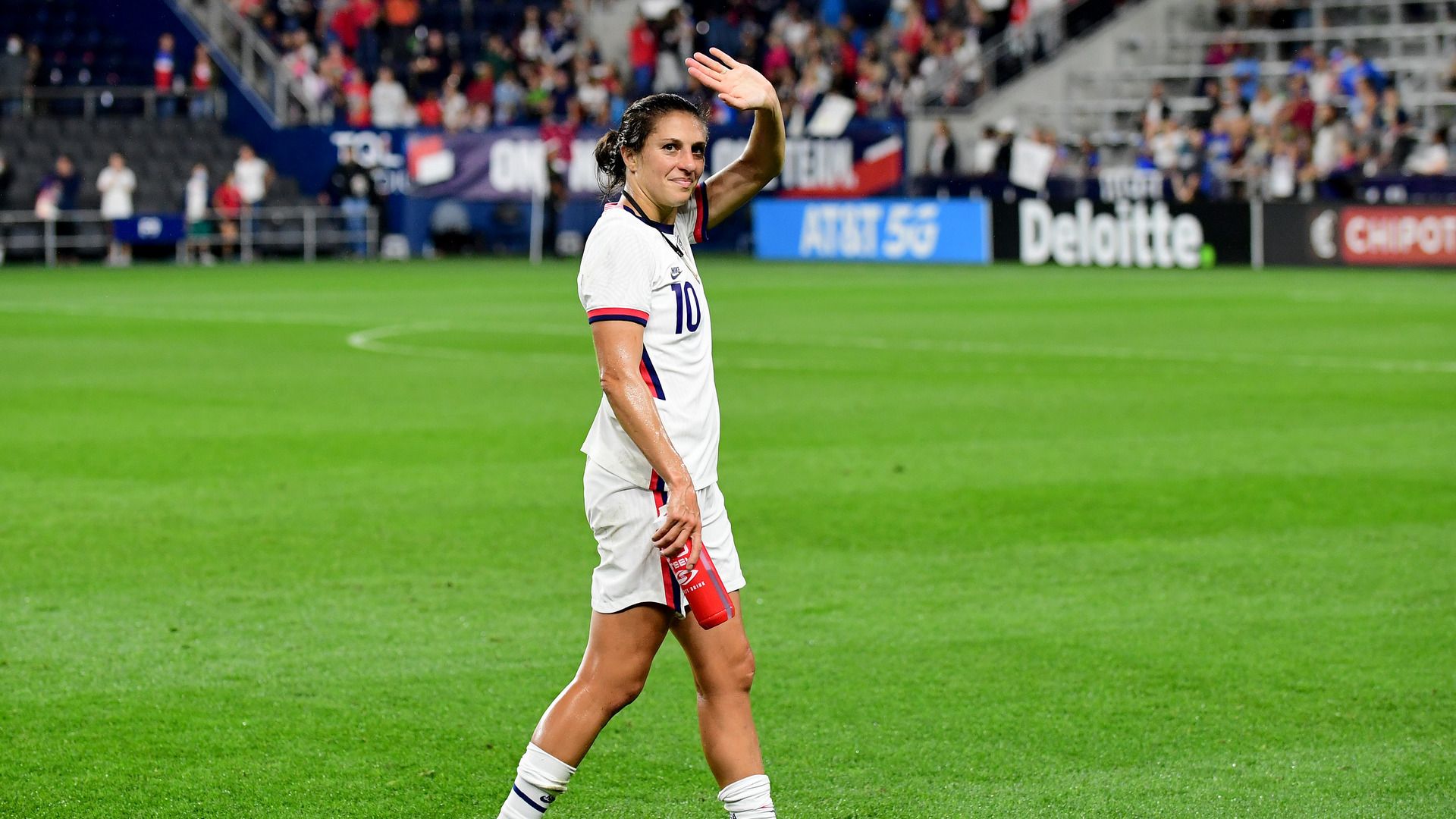 Carli Lloyd of USA waves to fans