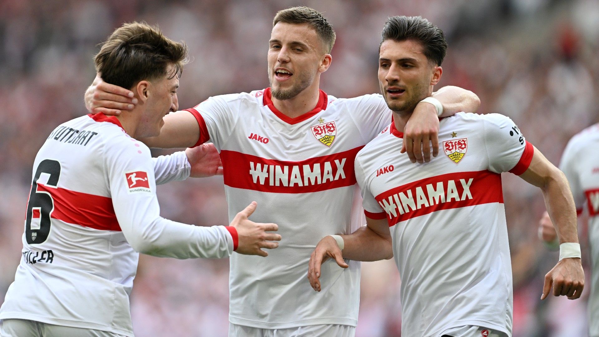 Leonidas Stergiou of VfB Stuttgart celebrates scoring his team's first goal with teammates Angelo Stiller and Ermedin Demirovic