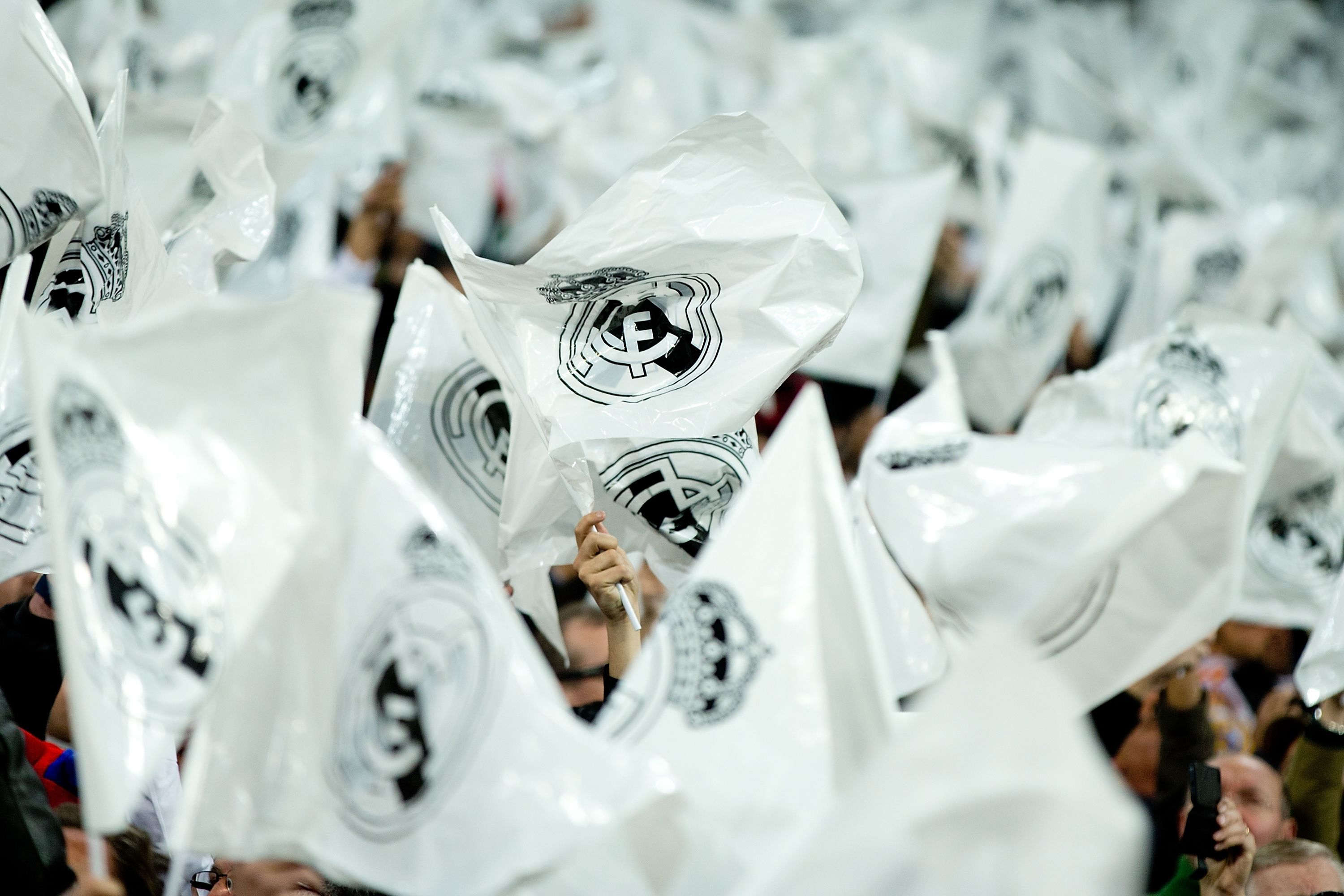 Real Madrid fans flutter Real Madrid flags