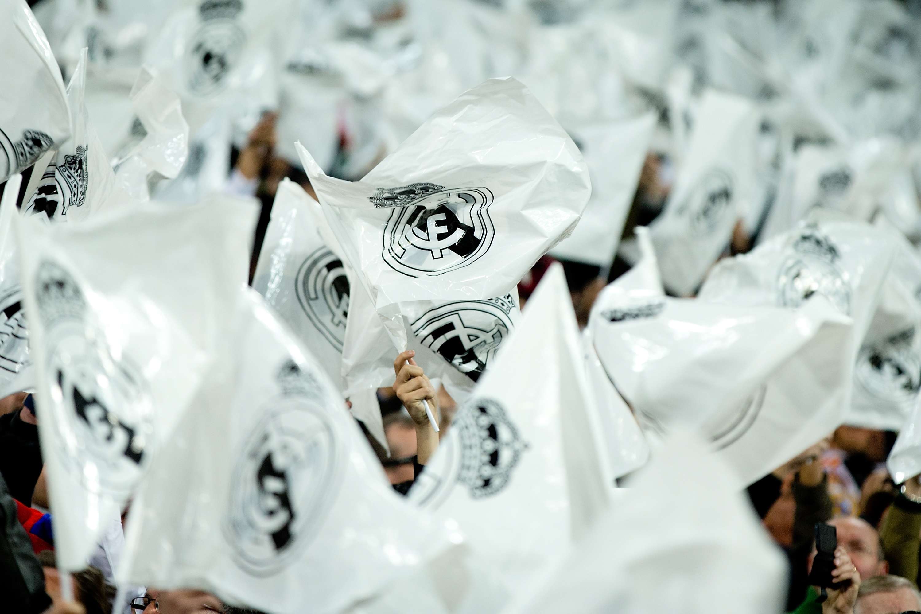 Real Madrid fans flutter Real Madrid flags