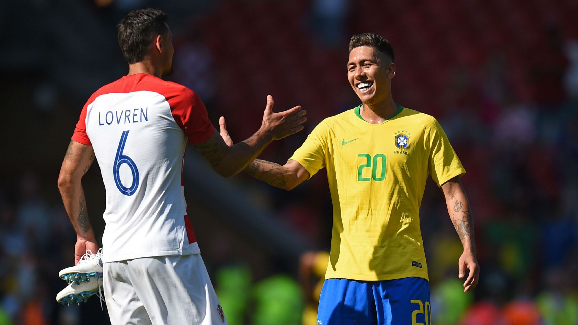 Dejan Lovren and Roberto Firmino