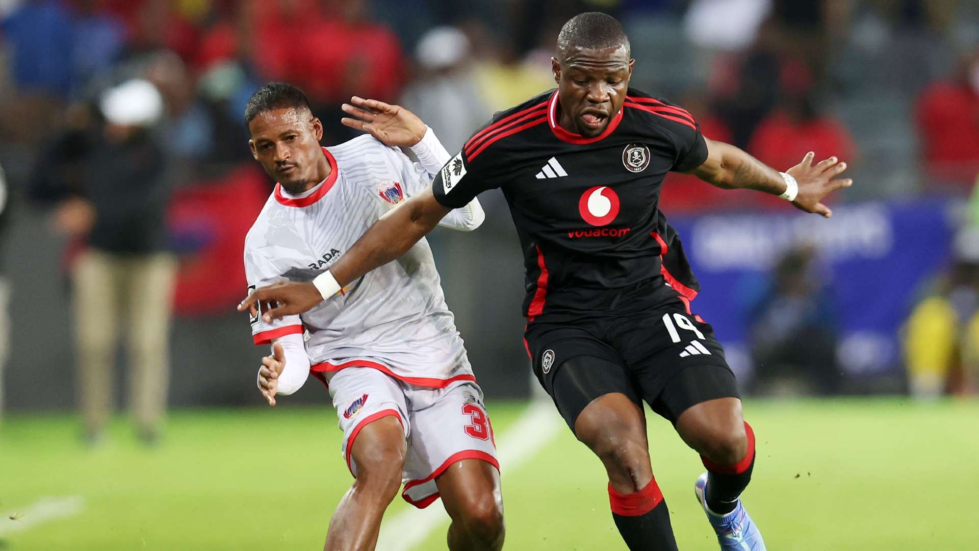 Tshegofatso Mabasa of Orlando Pirates and Craig Martin of Chippa United