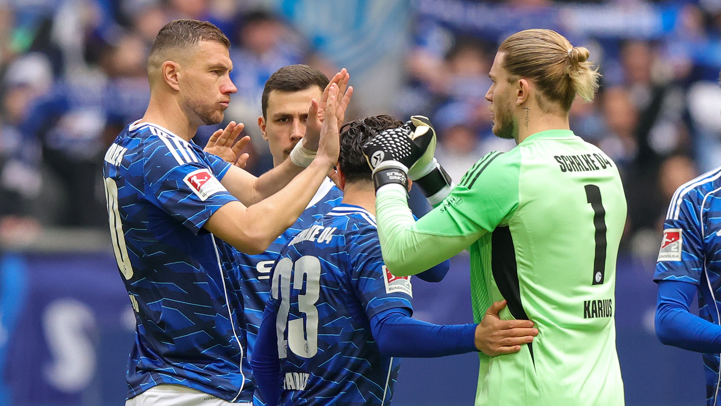 Schalke Secures Future: Karius & Dzeko Eyed After Bundesliga Return