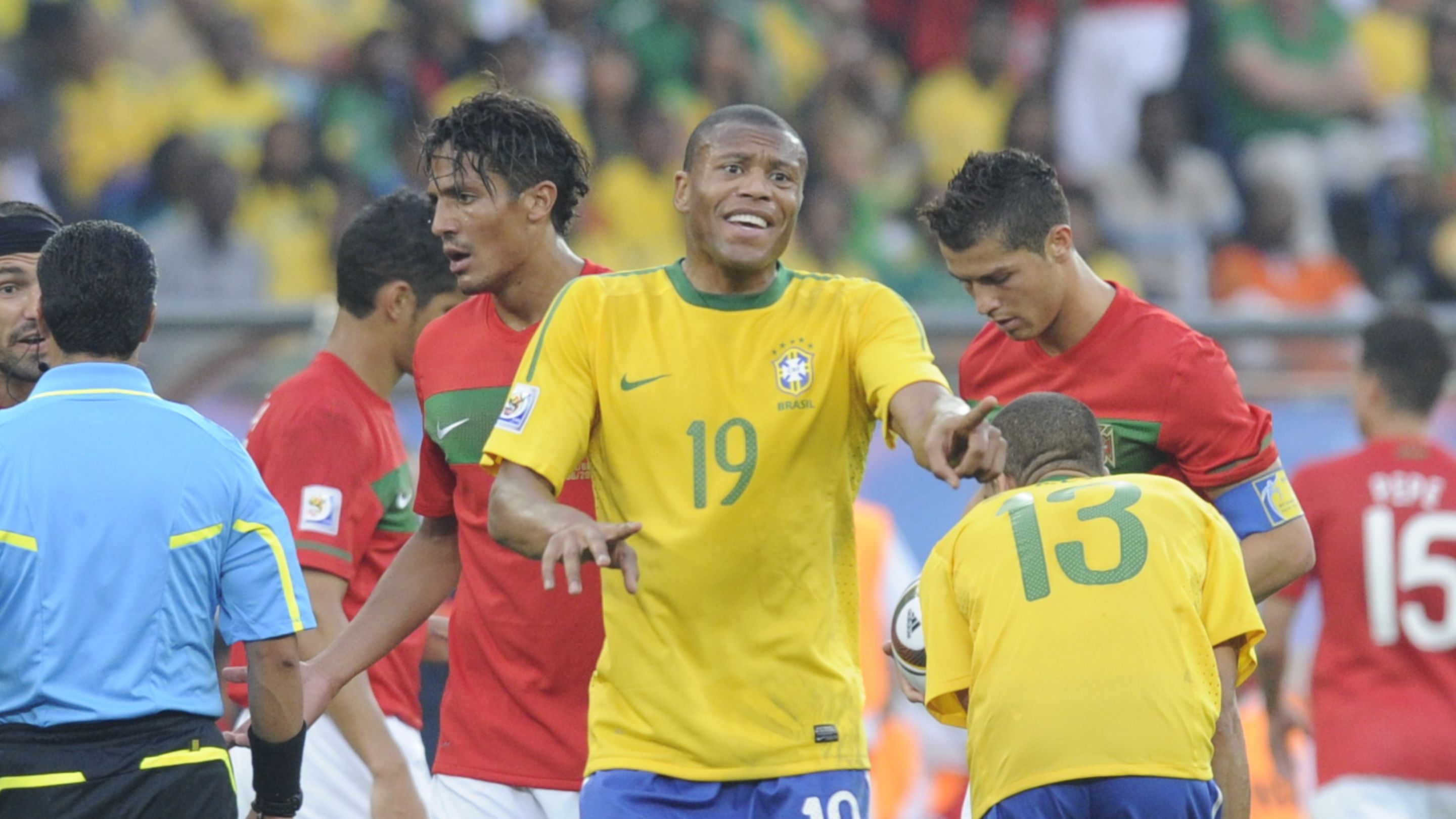 Brazil's midfielder Julio Baptista react