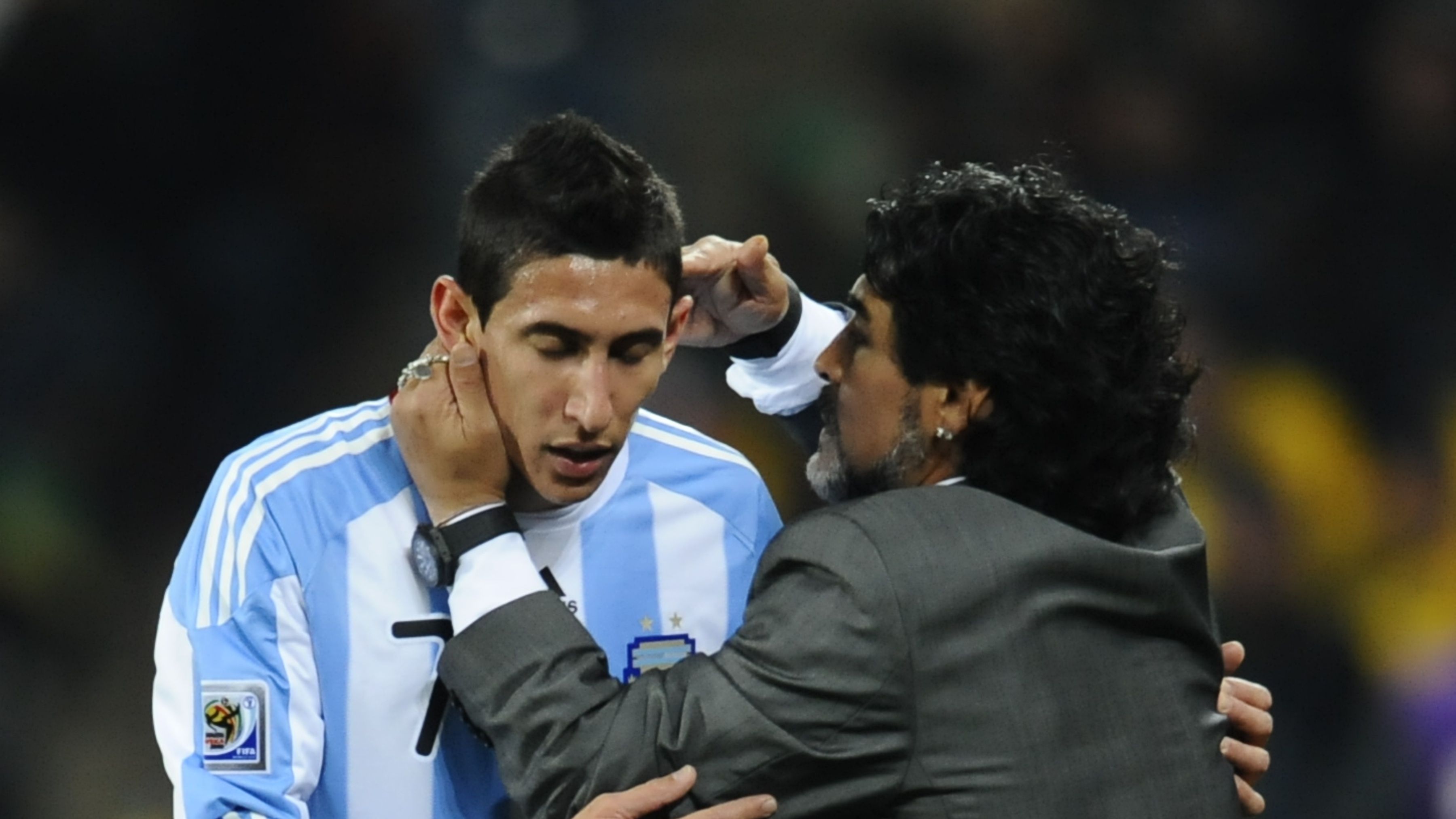 Argentina's coach Diego Maradona (R) spe