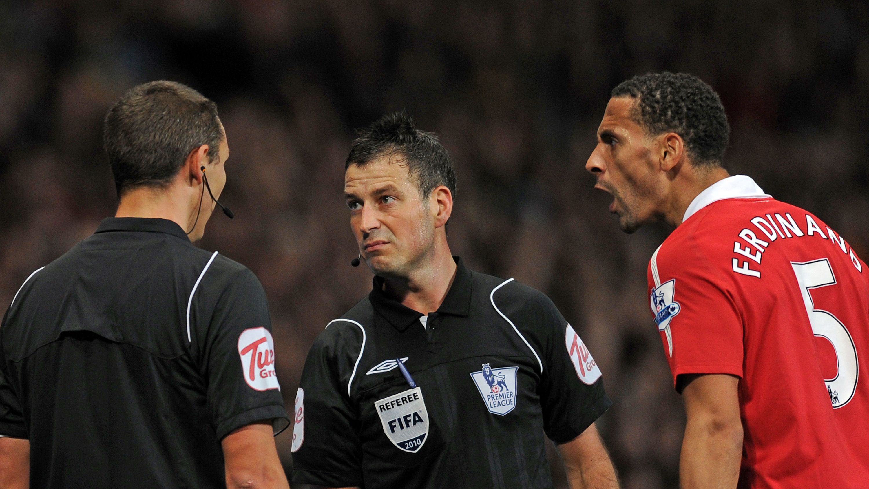 Referee Mark Clattenburg (2nd L) consult