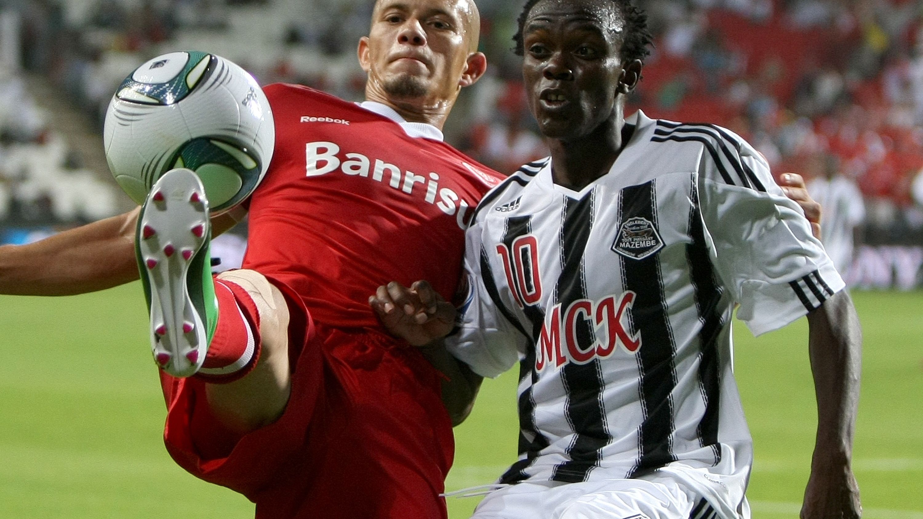 Given Singuluma (L) of TP Mazembe of the