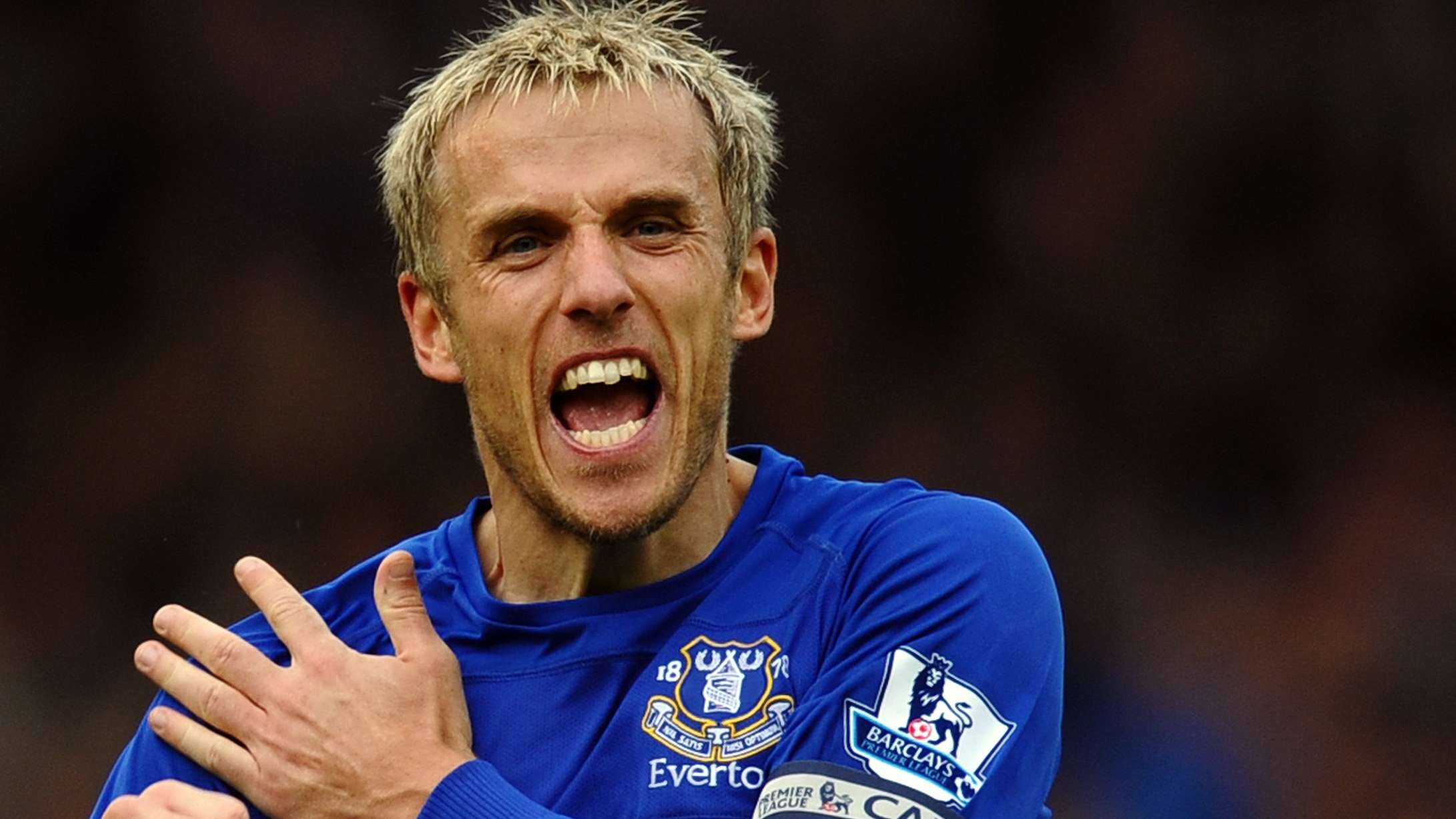 Everton captain Phil Neville celebrates