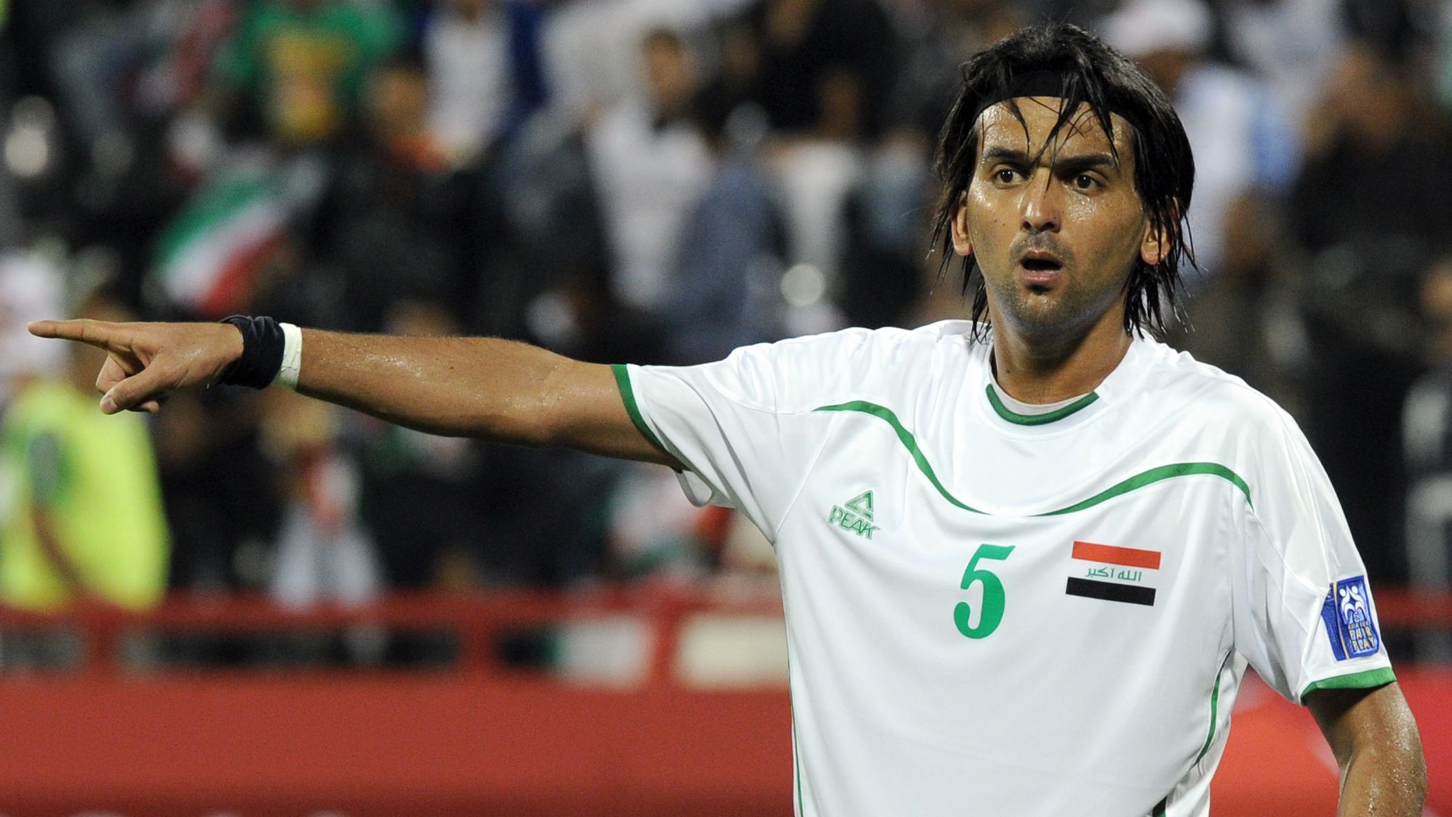 Iraq's midfielder Nashat Akram gestures