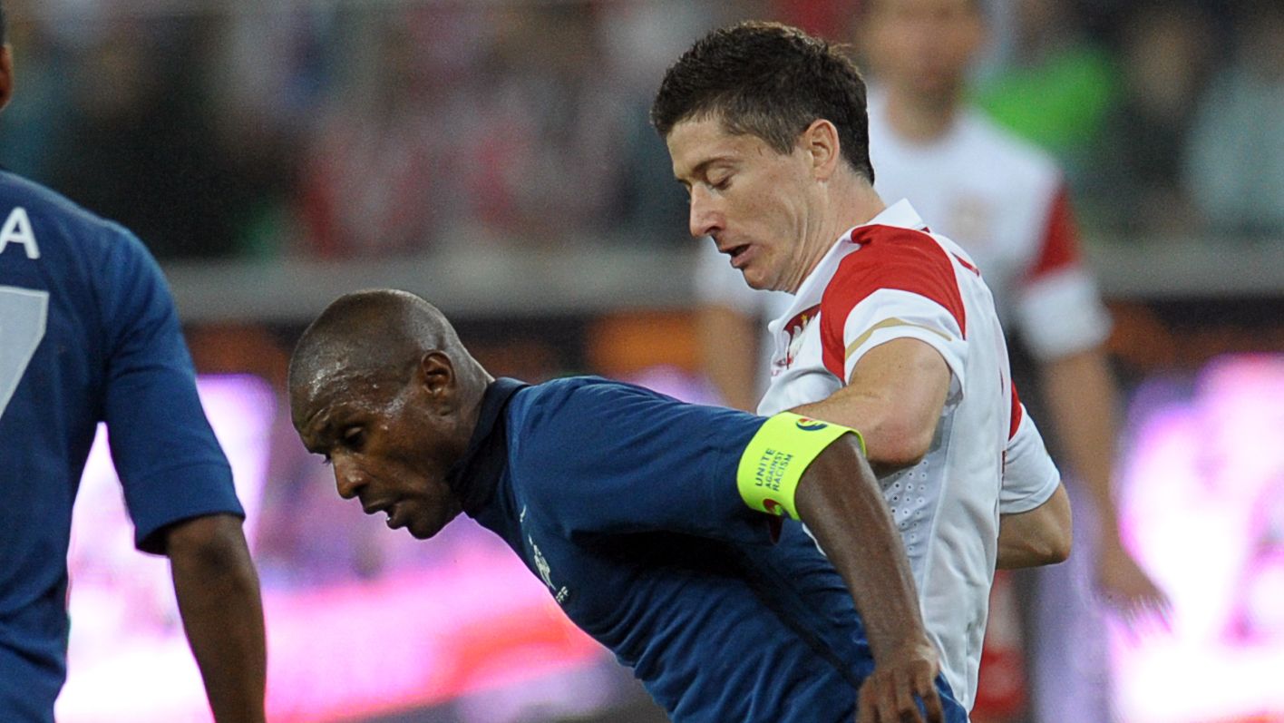 French Eric Abidal (L) vies with Polish