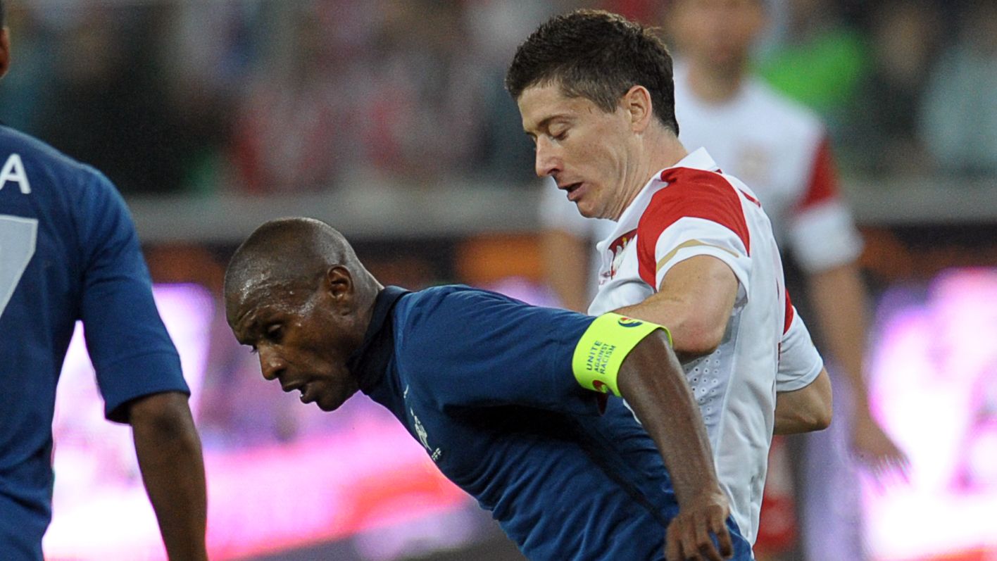 French Eric Abidal (L) vies with Polish