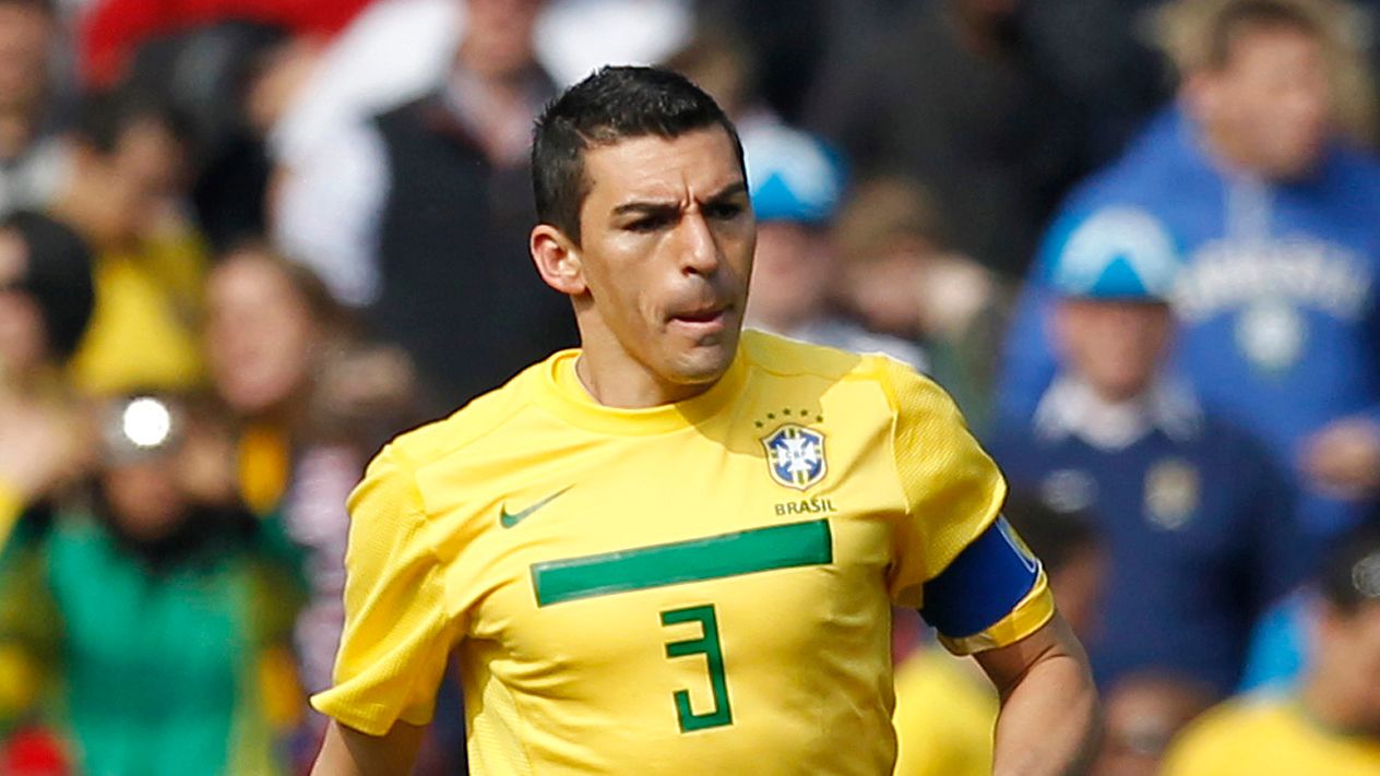 Brazil's Captain Lucio runs with the bal