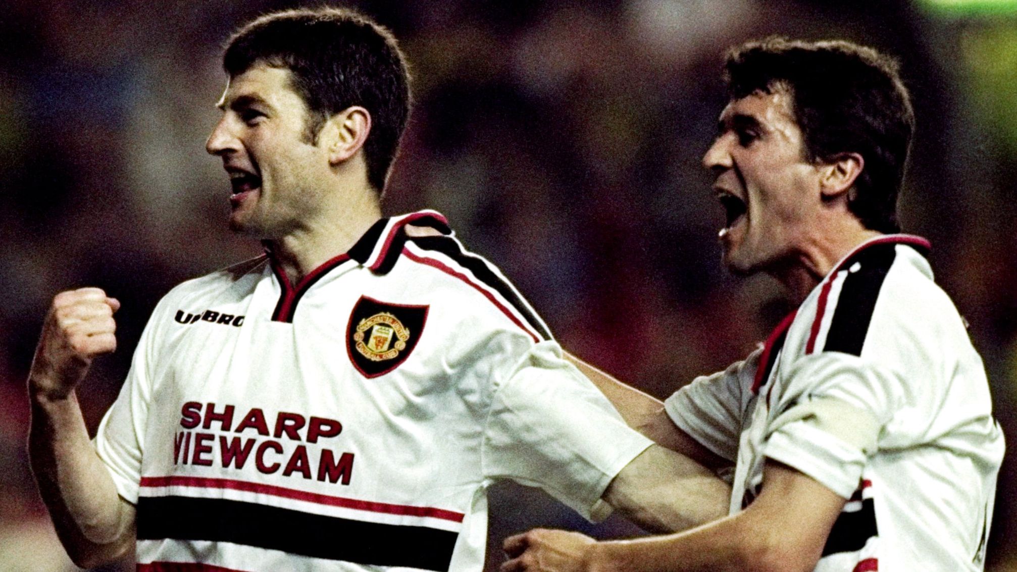Dennis Irwin and Roy Keane of Manchester United