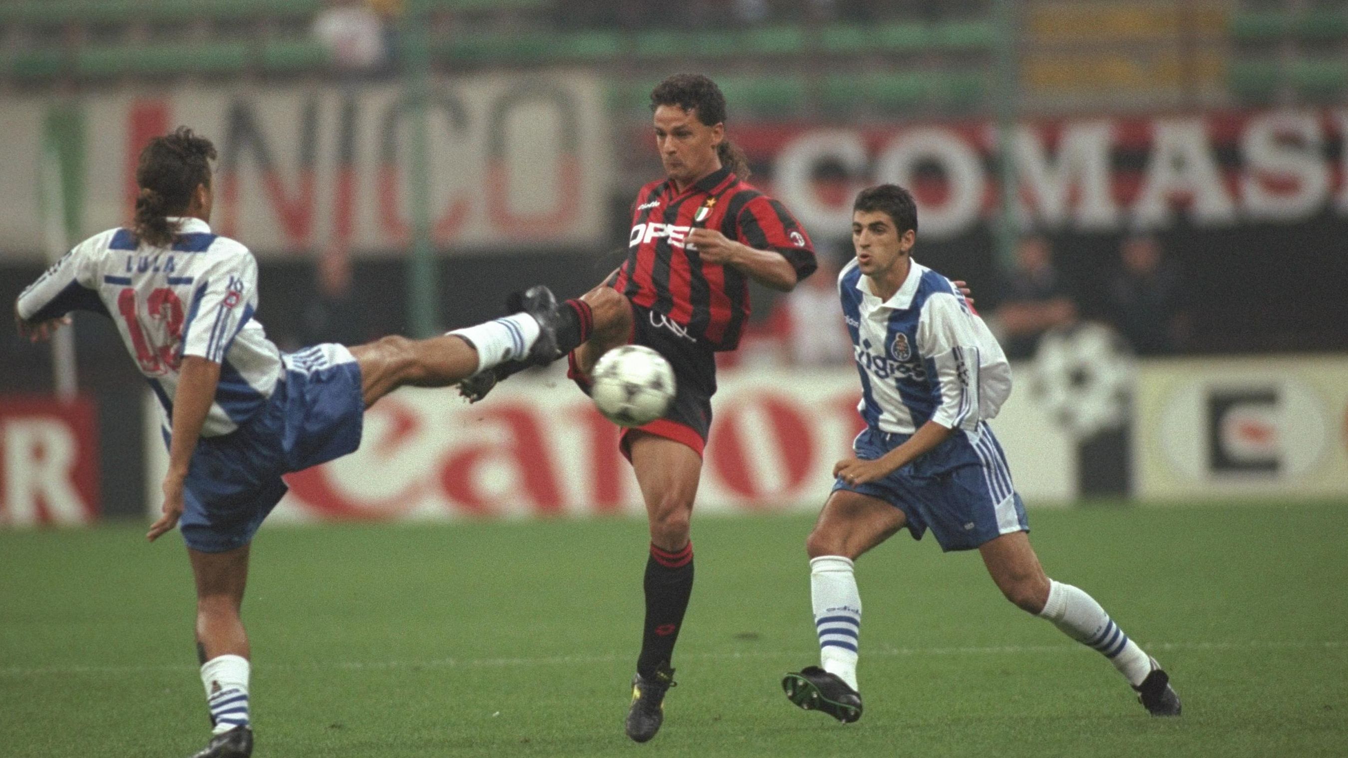 Roberto Baggio of A.C Milan (right) challenges Lula of Porto