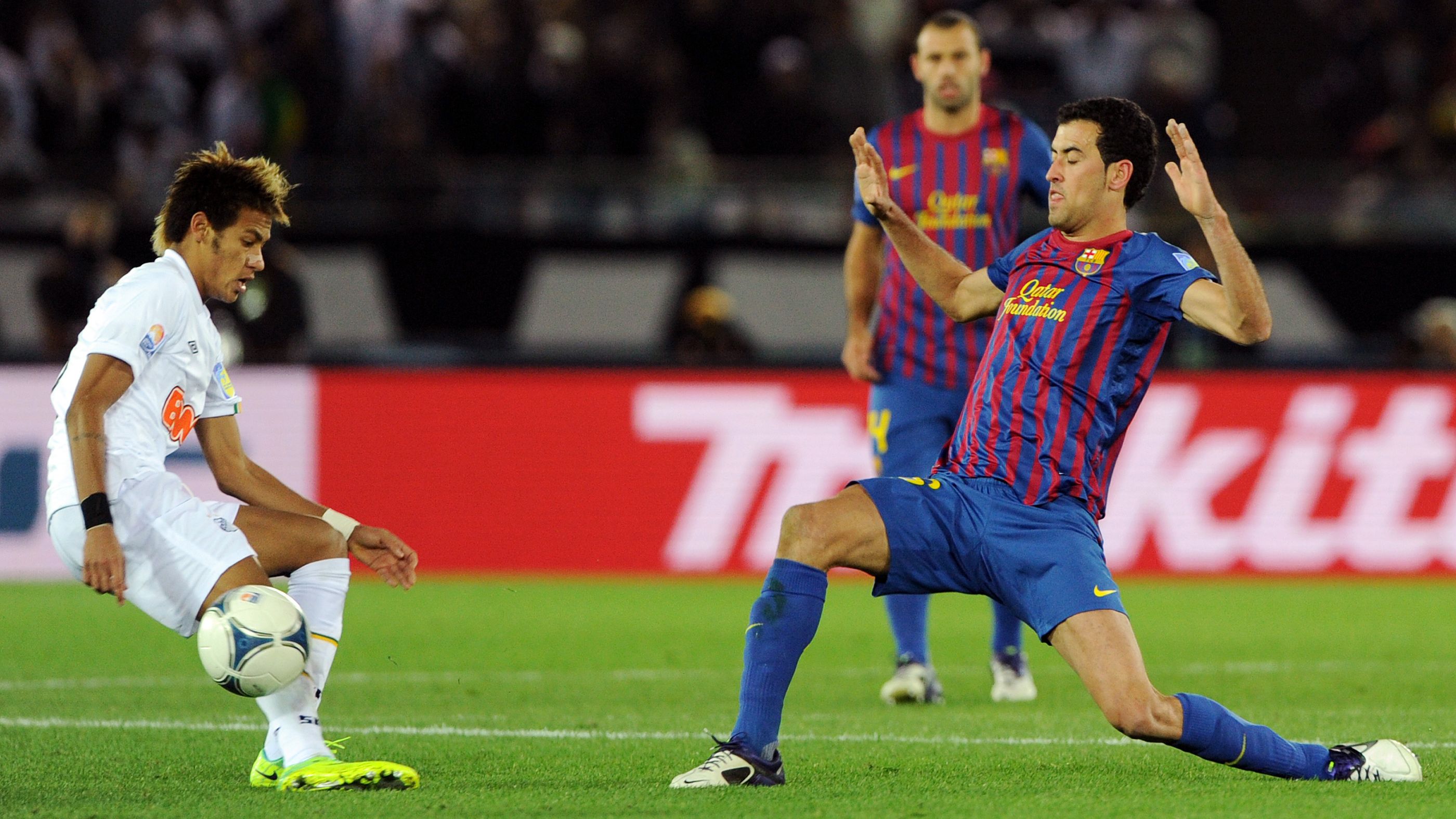 Santos FC forward Neymar (L) fights for