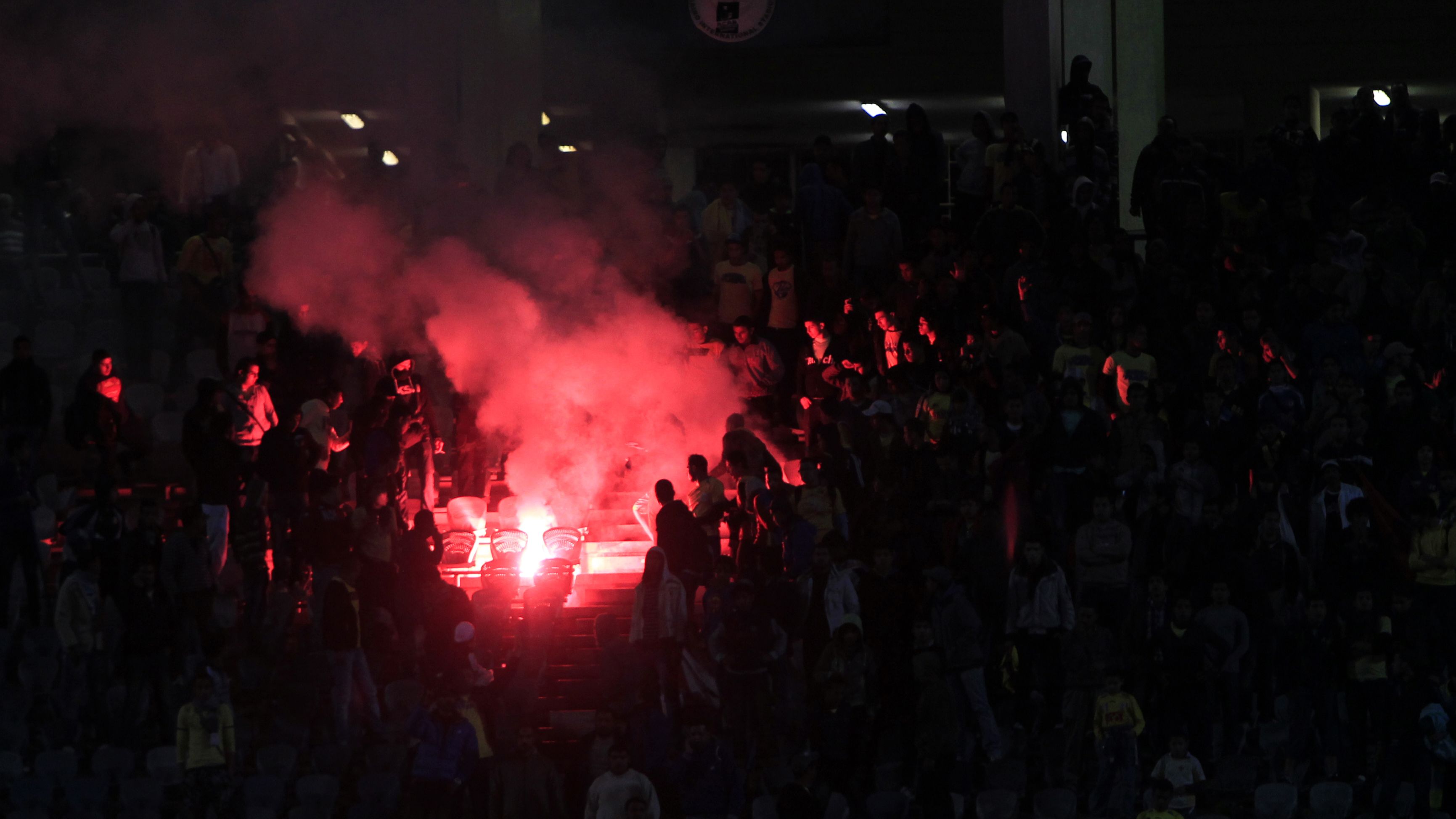 A flare is lit in Cairo Stadium during t