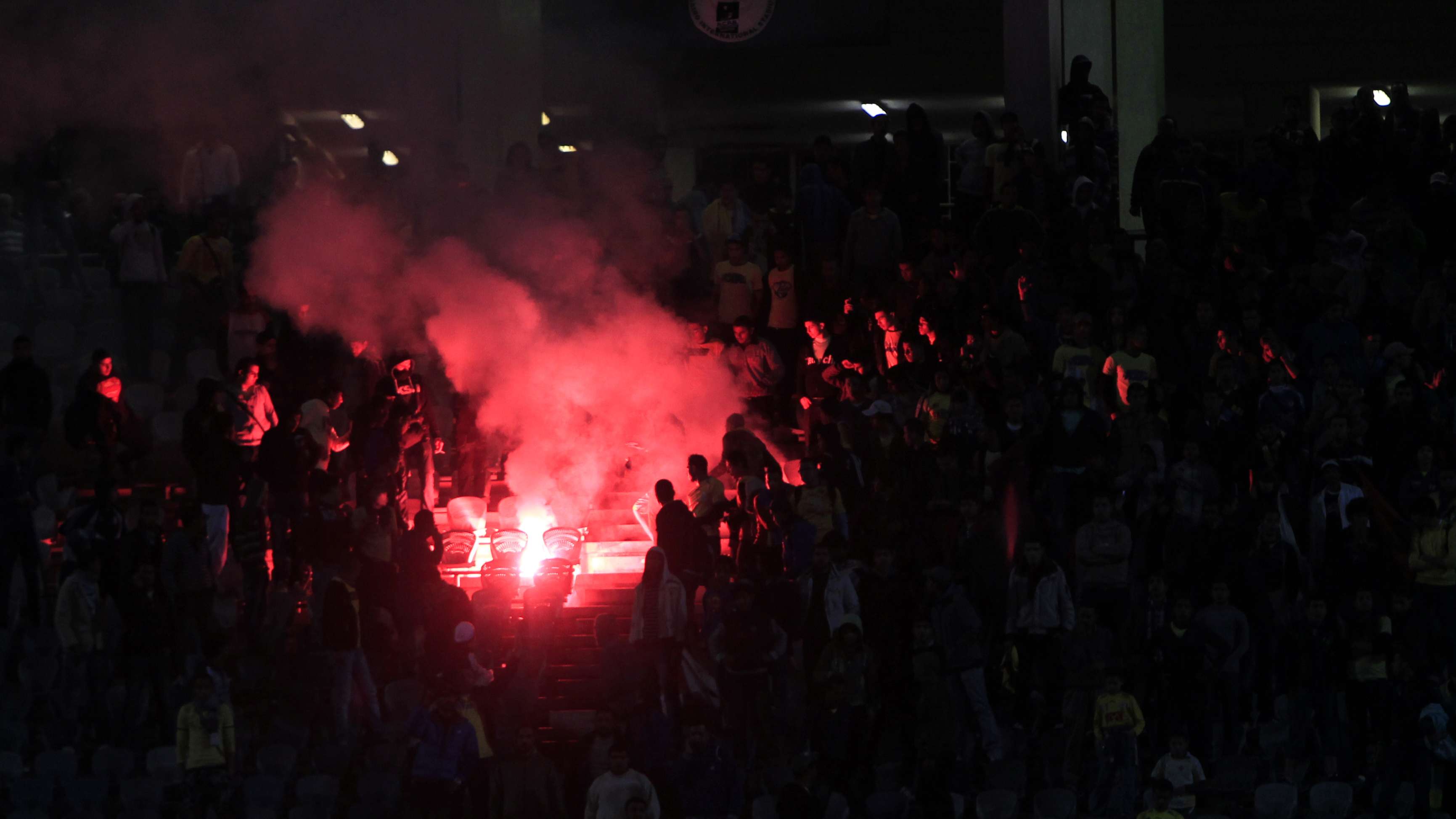A flare is lit in Cairo Stadium during t