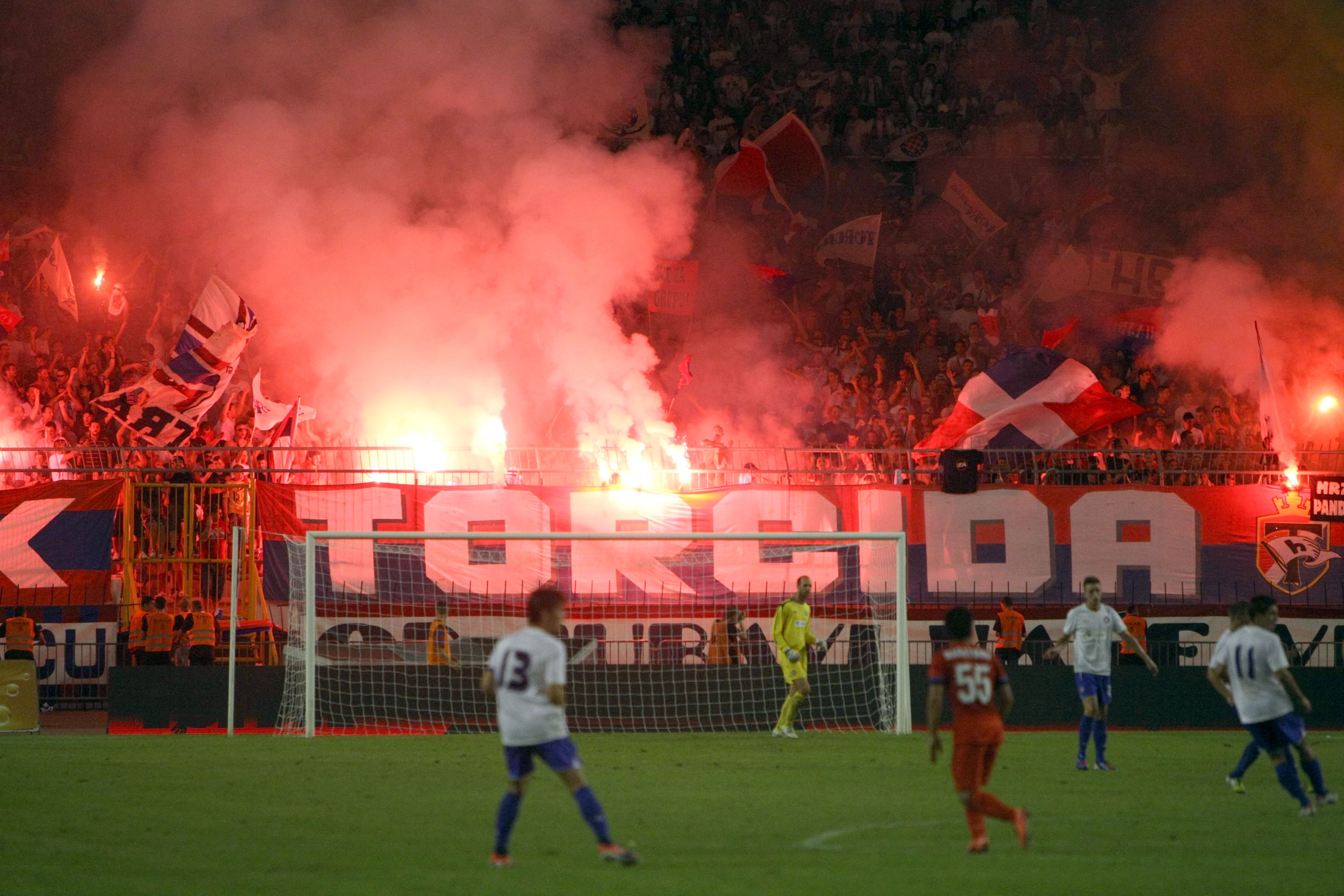 Hajduk Split's fans use flares during the match