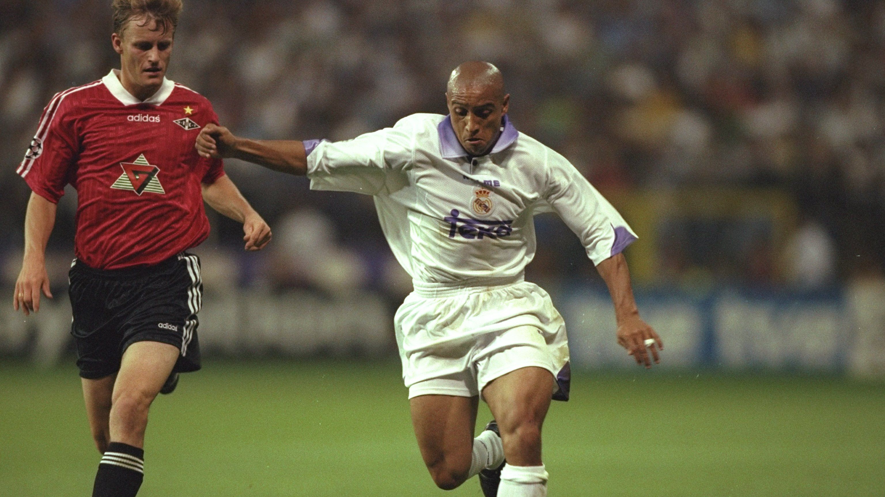 Pedrag Mijatovic of Real Madrid and Heggem of Rosenborg