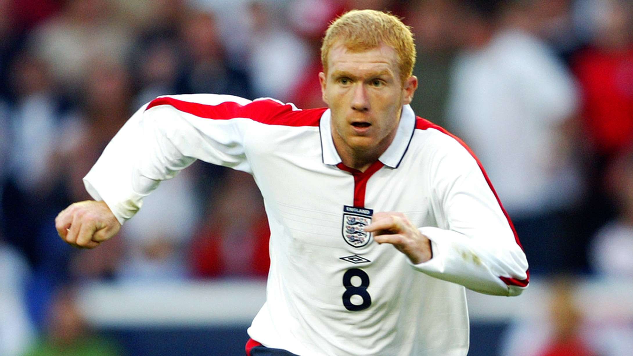 Paul Scholes of England chases the ball