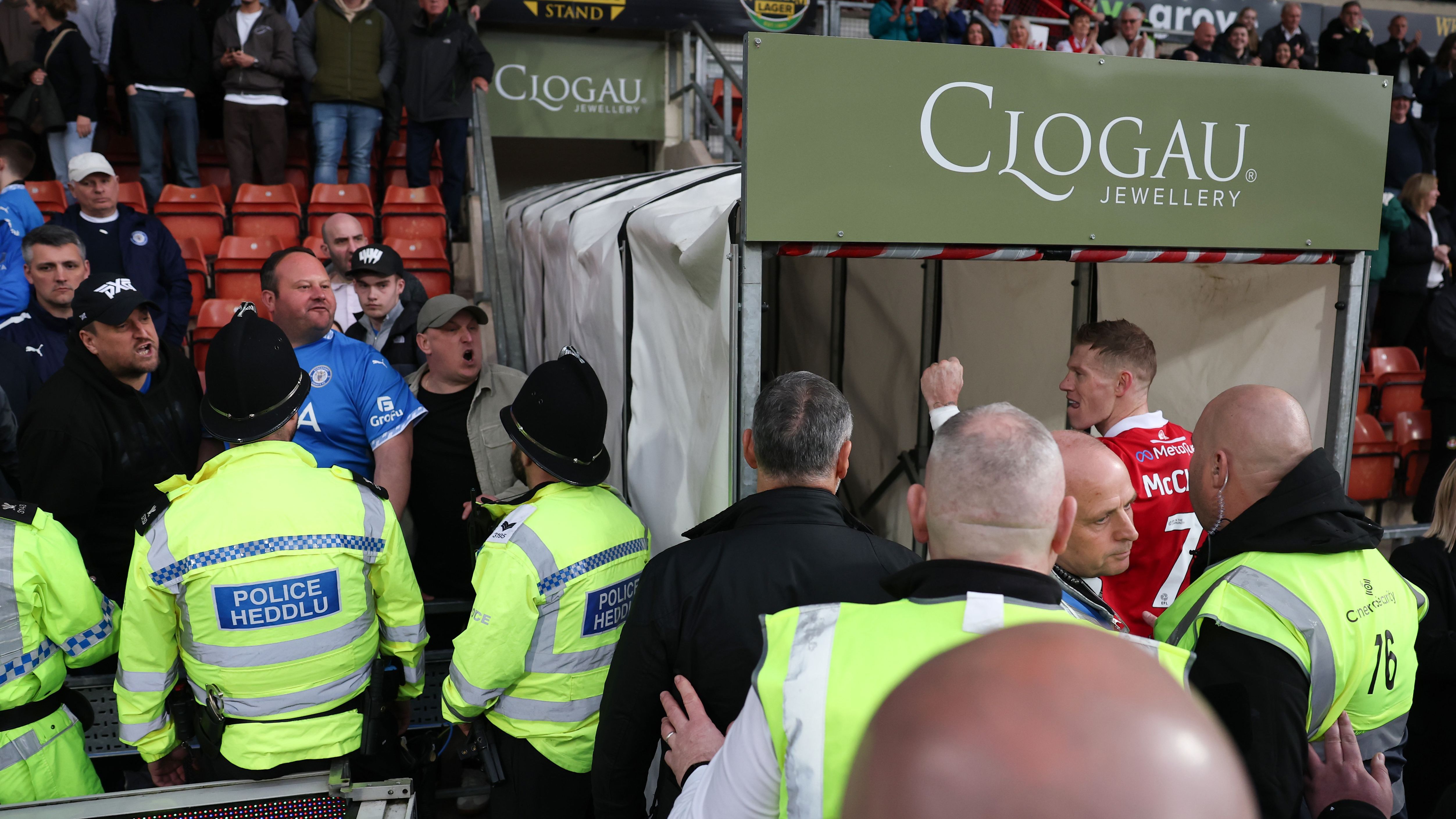 Trouble at Wrexham! Police forced to intervene as James McClean is involved in angry altercation with Stockport fan after controversial penalty decision