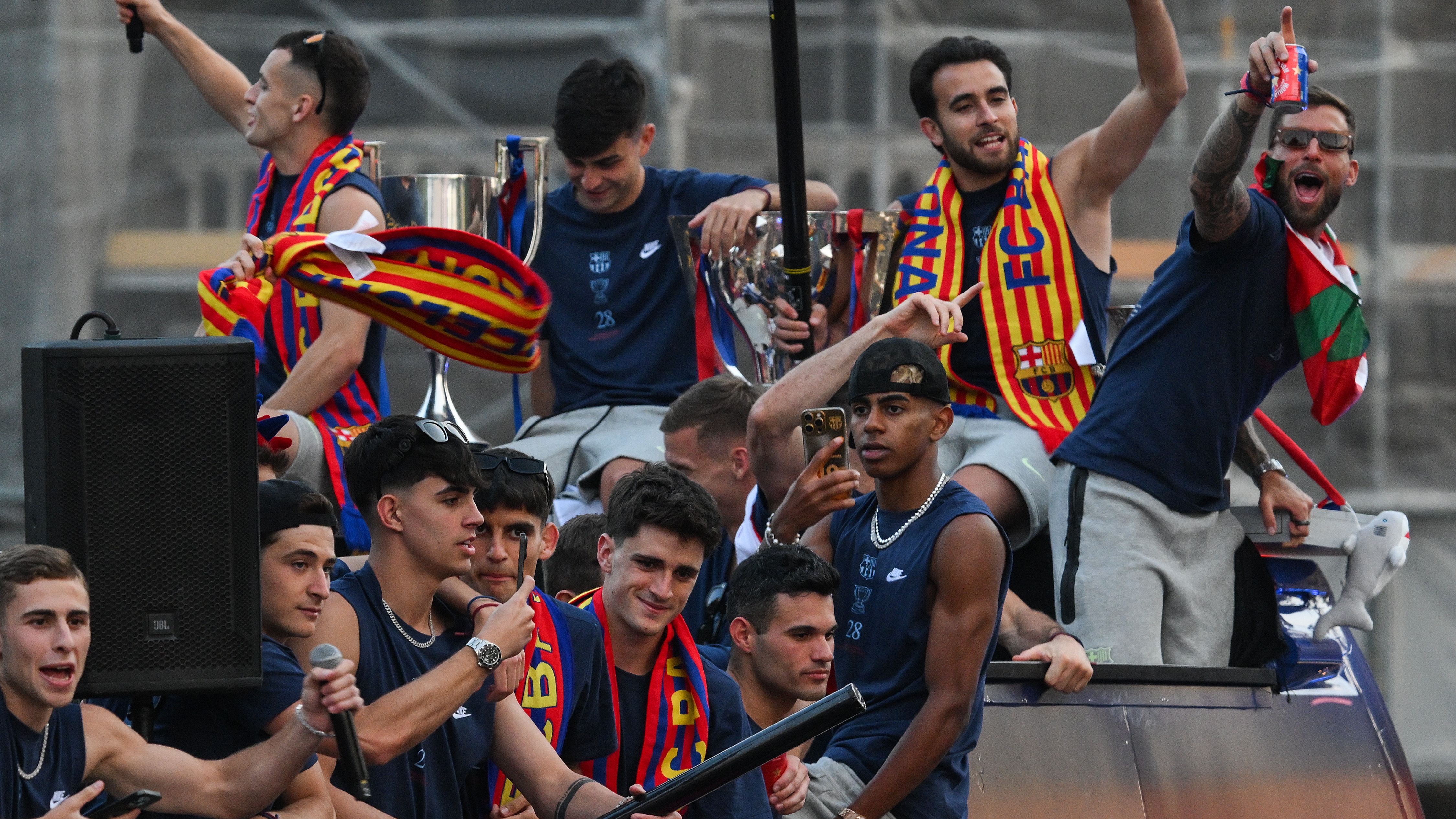 Barcelona players fall during La Liga victory open top bus parade