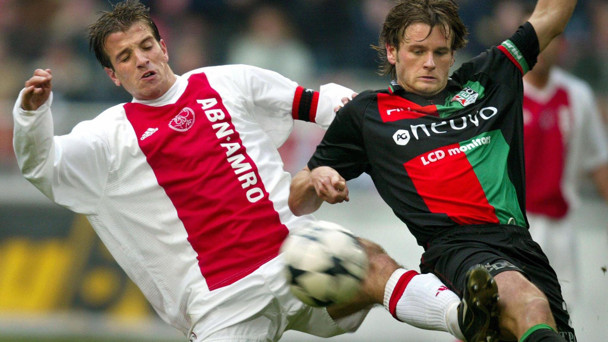 Ajax'  Rafael van der Vaart fights for t