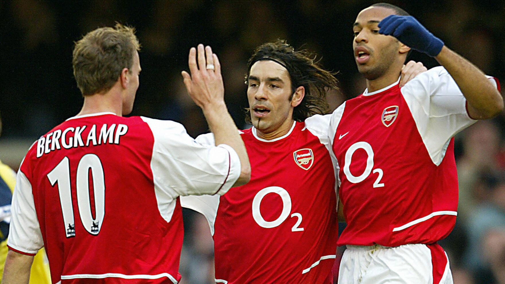 Arsenal's  Dennis Bergkamp celebrates hi
