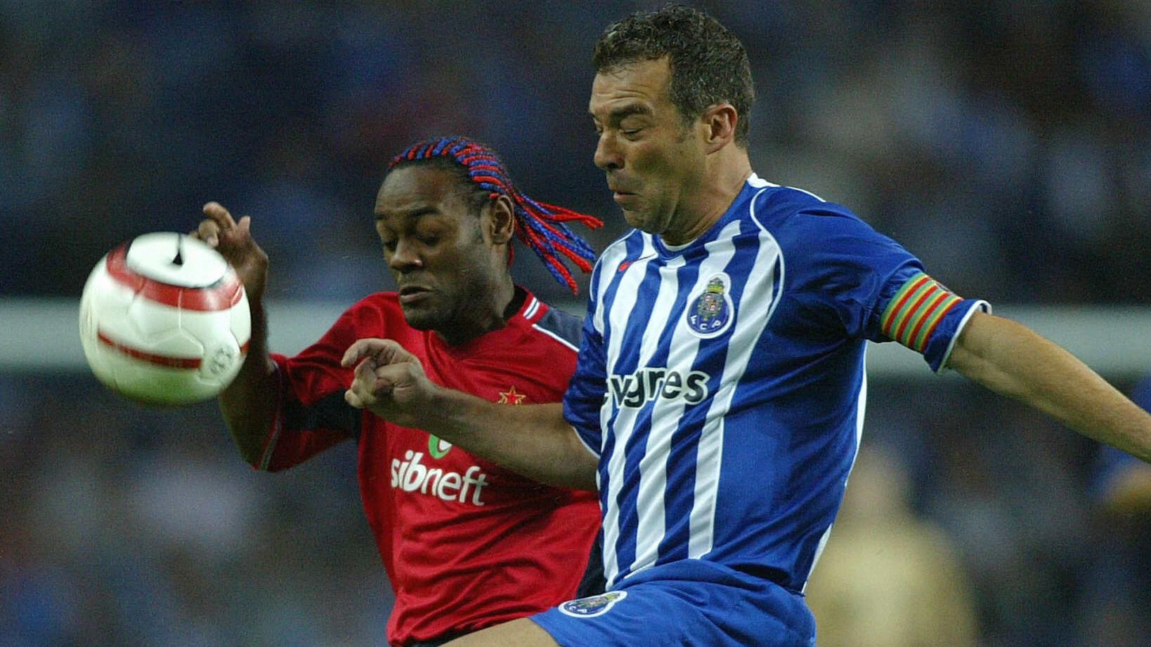 FC Porto's Jorge Costa (R) fights for th