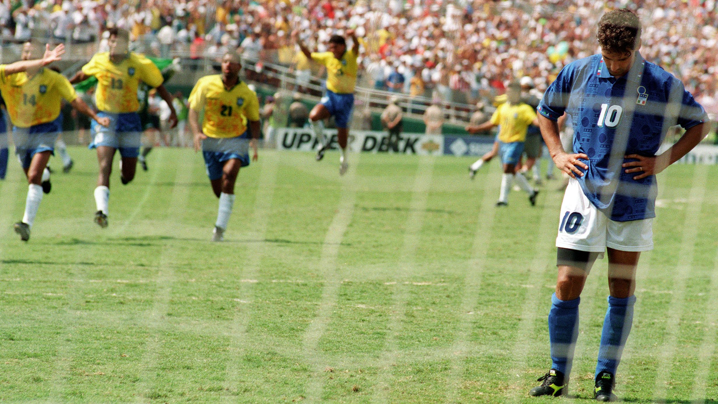 Brazilian players run to join their teammates as I