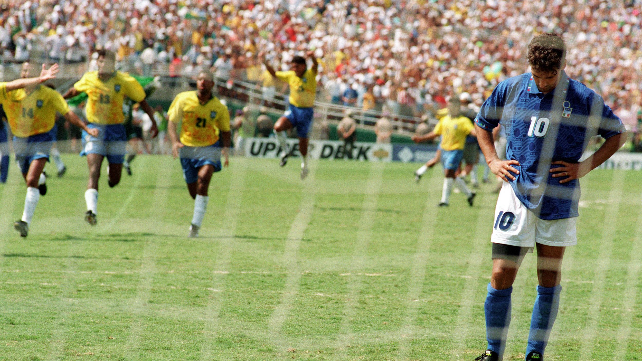 Brazilian players run to join their teammates as I