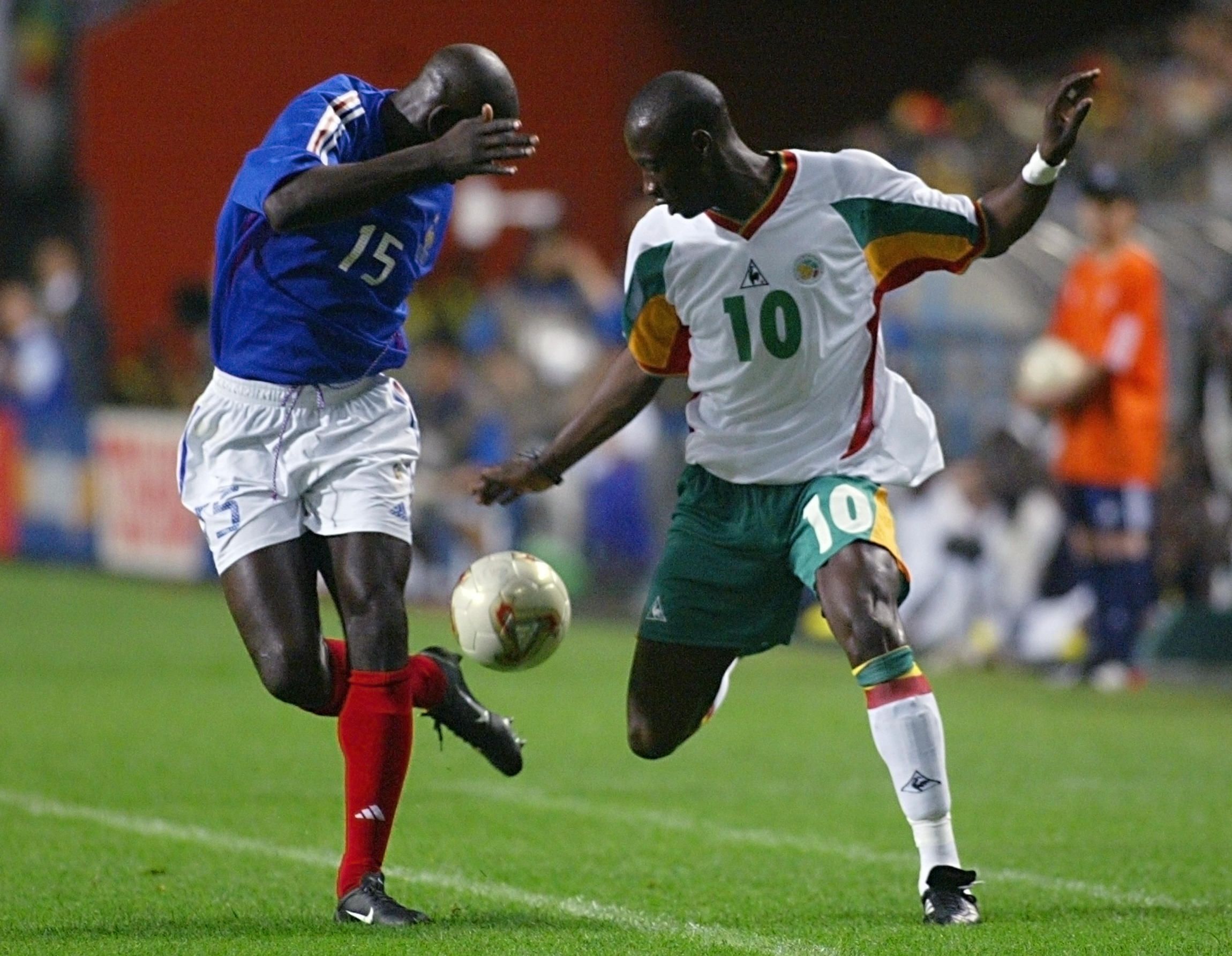 French defender Lilian Thuram (L) and Senegalese m