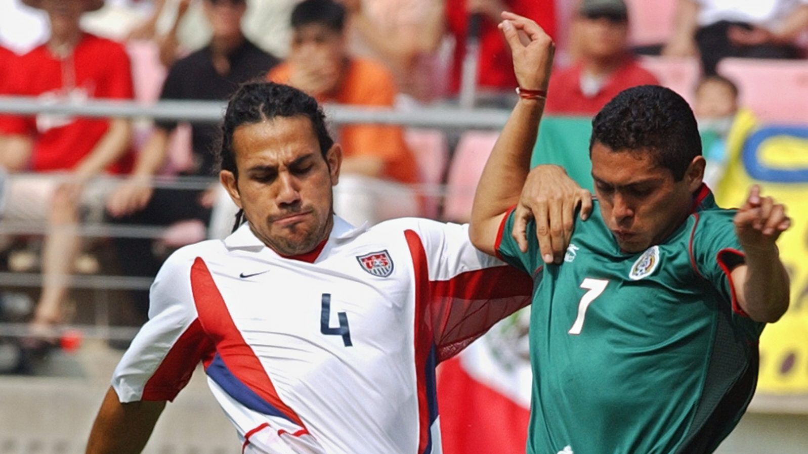 Mexico's Ramon Morales (R) vies for the ball with