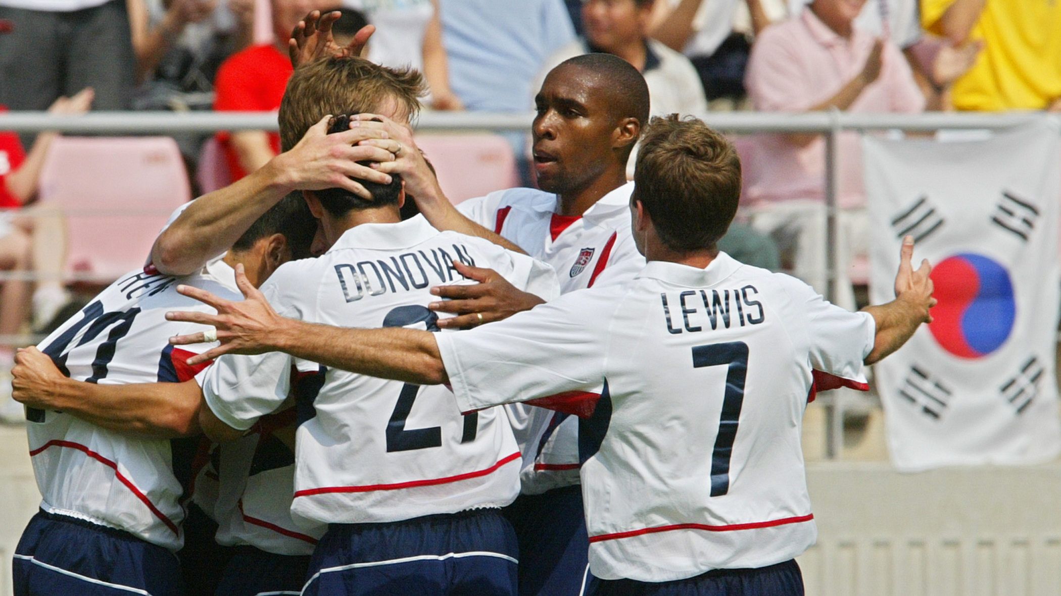 USA goalscorer Brian McBride (2/L) celebrates his