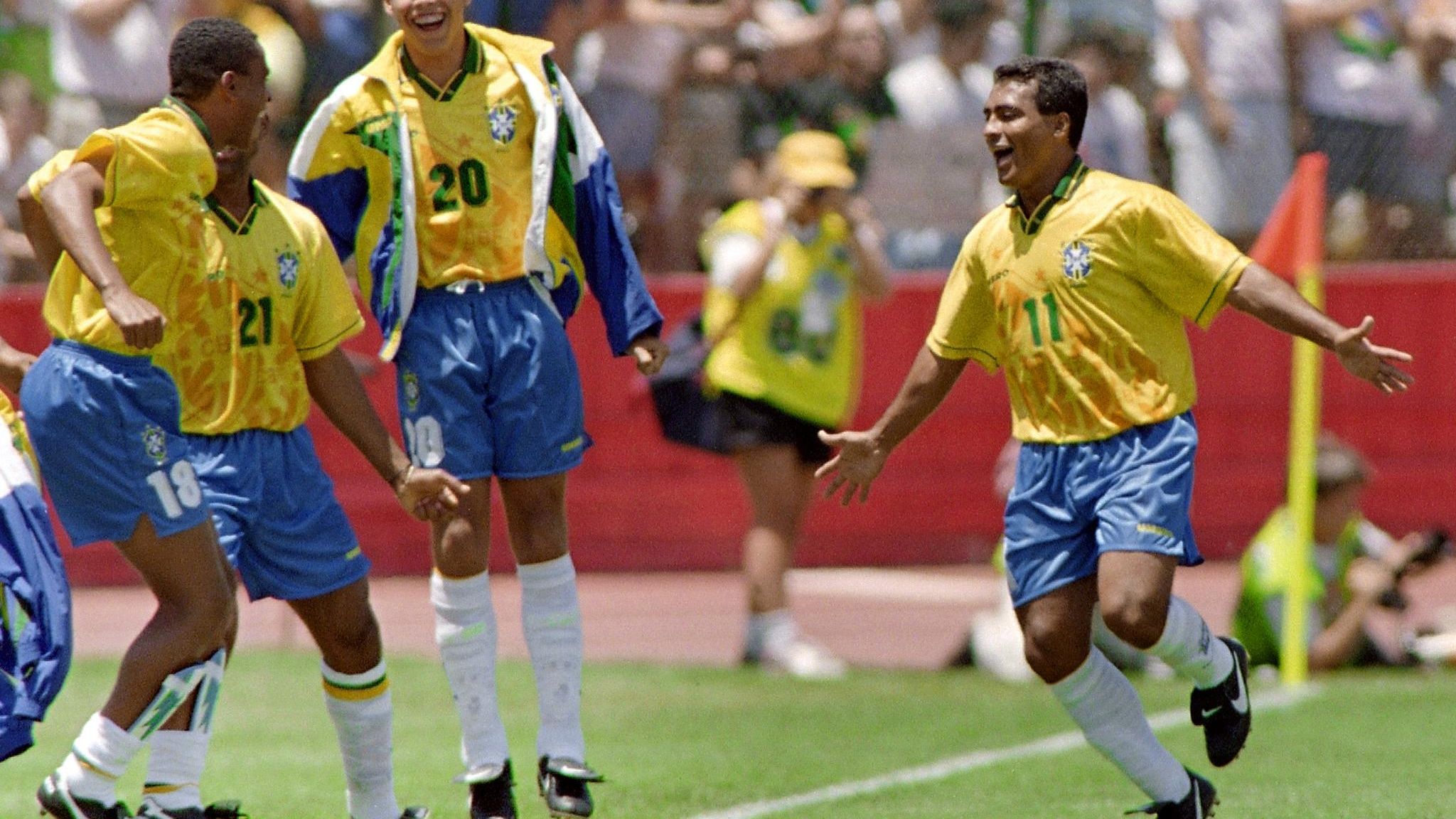 Brazilian forward Romario runs towards his teammat