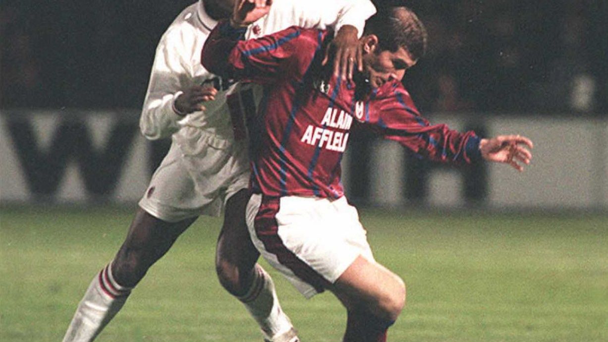 Bordeaux's Zinedine Zidane (R) struggles to keep M