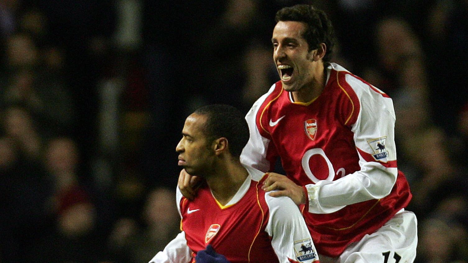 Arsenal's Edu (R) jumps in the air to ce