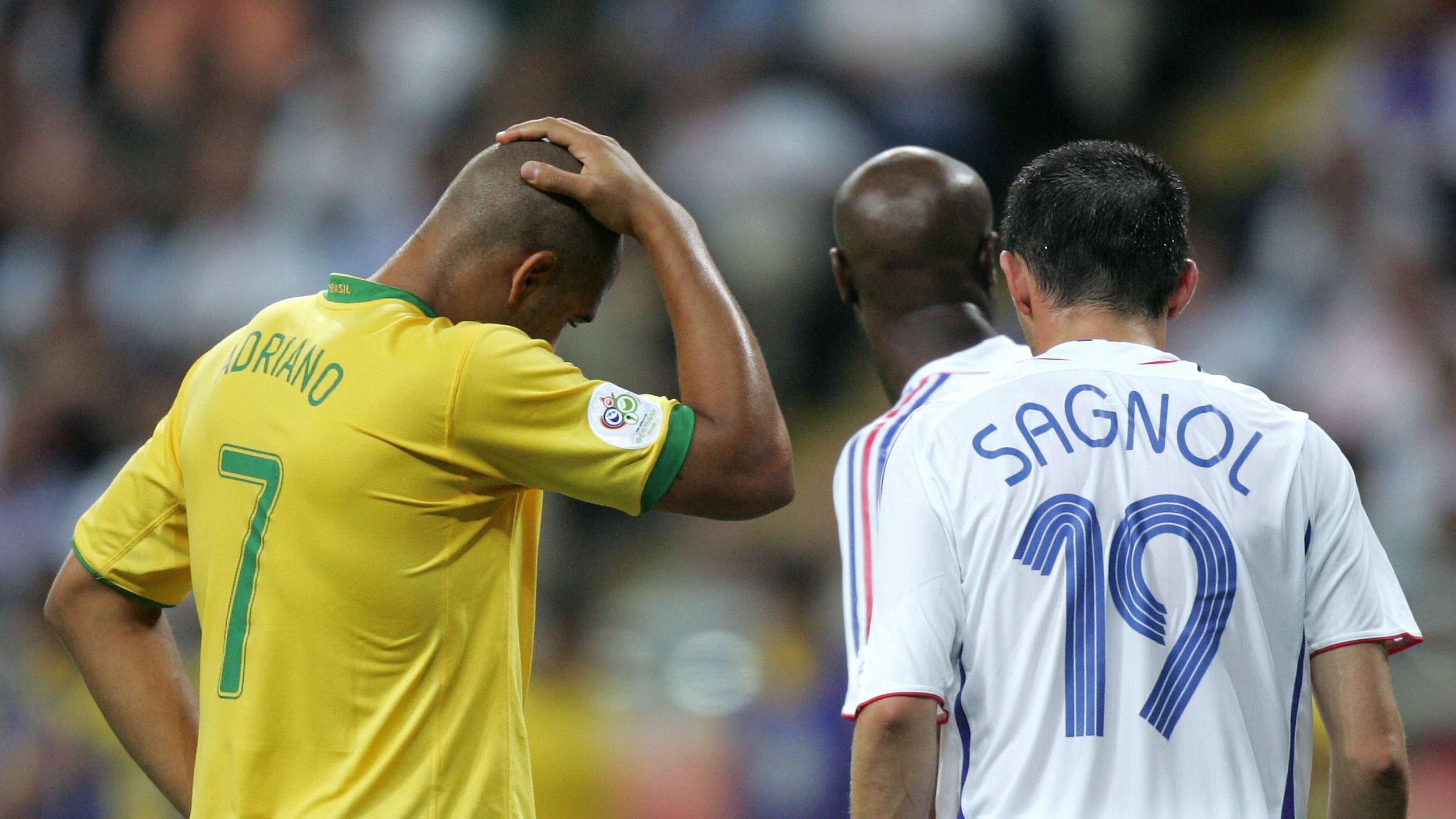 Brazilian forward Adriano (L) reacts as