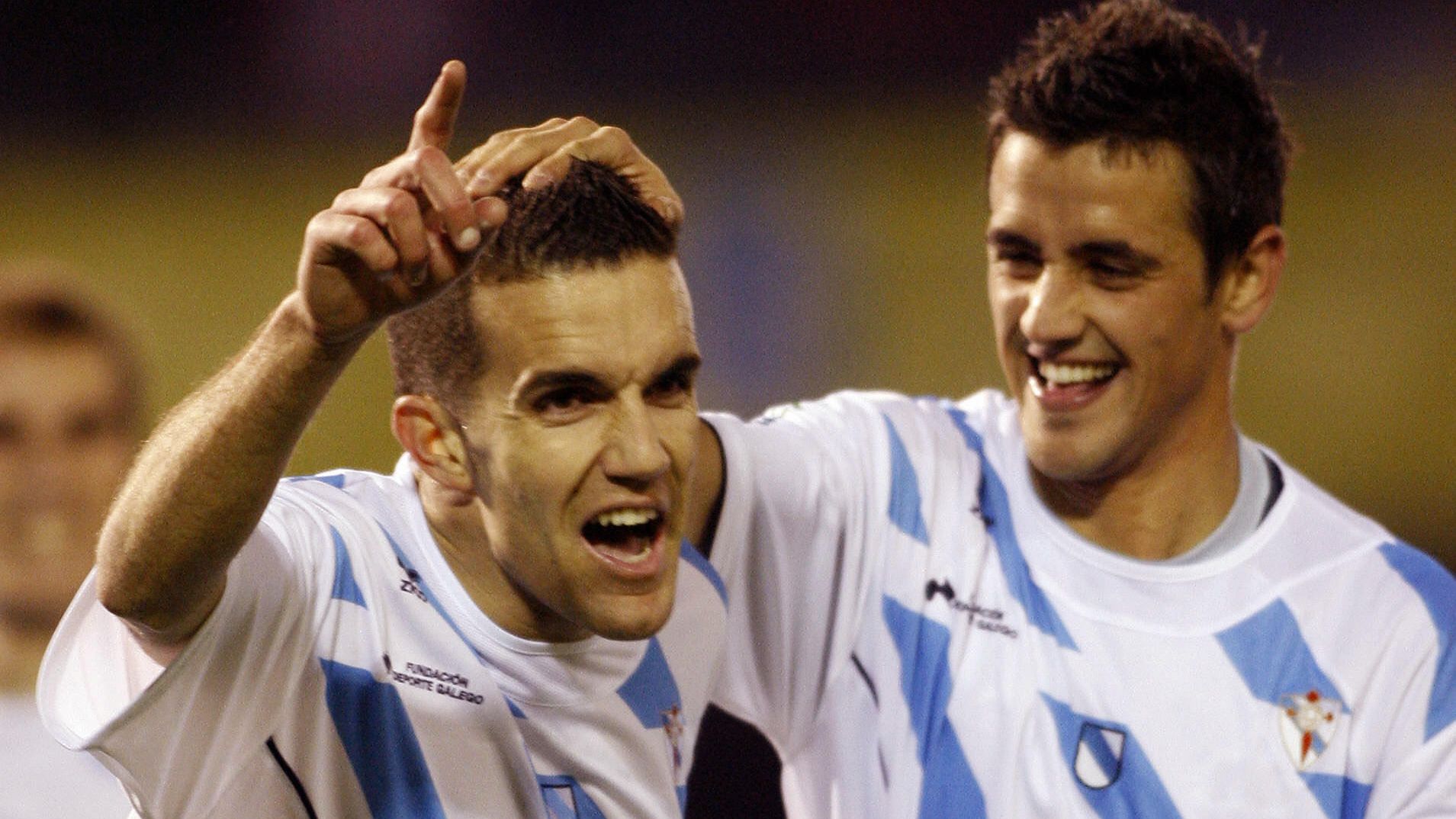 Galicia's Julio Alvarez (L) celebrates w