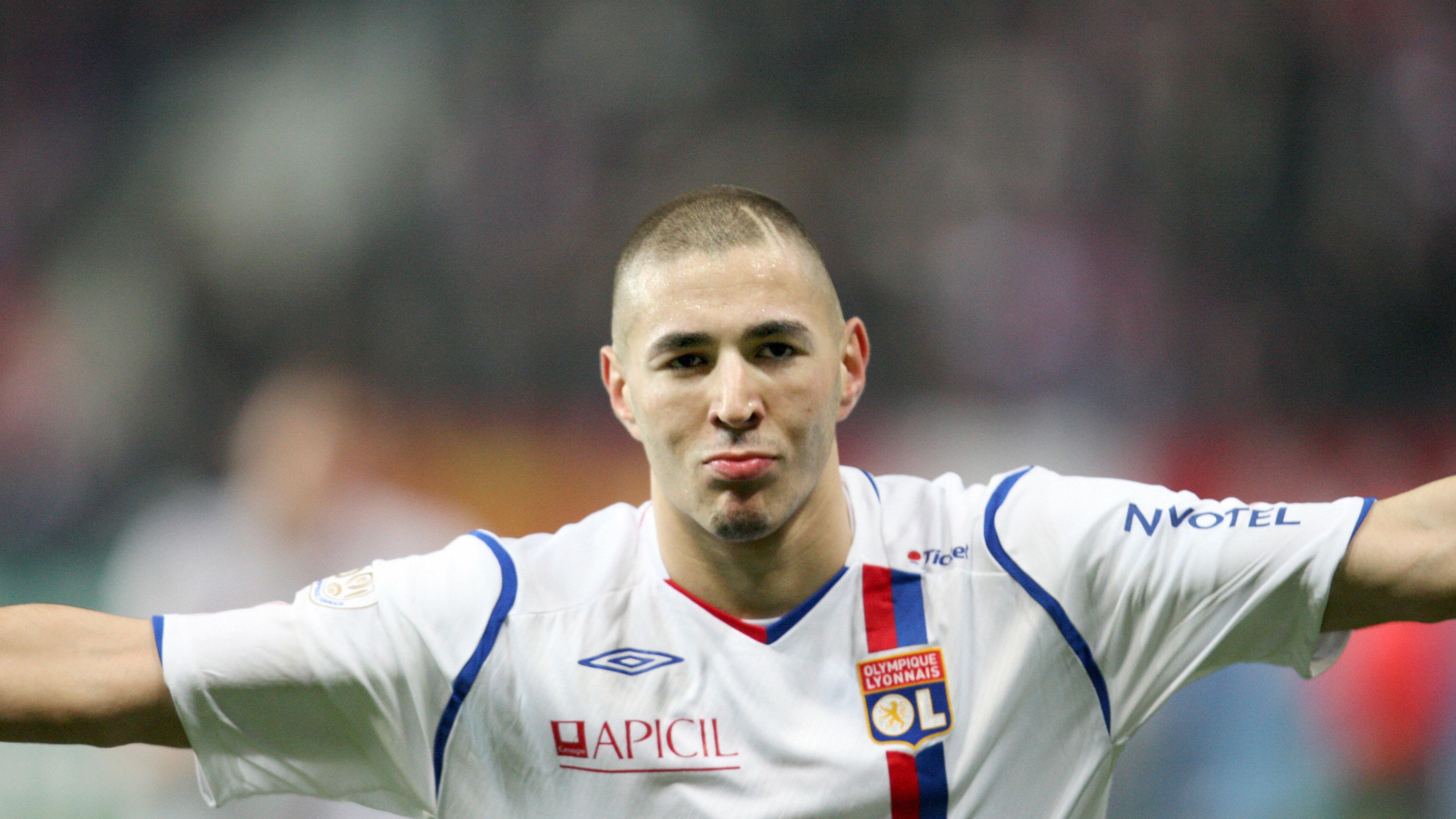 Lyon's Karim Benzema reacts after he sco
