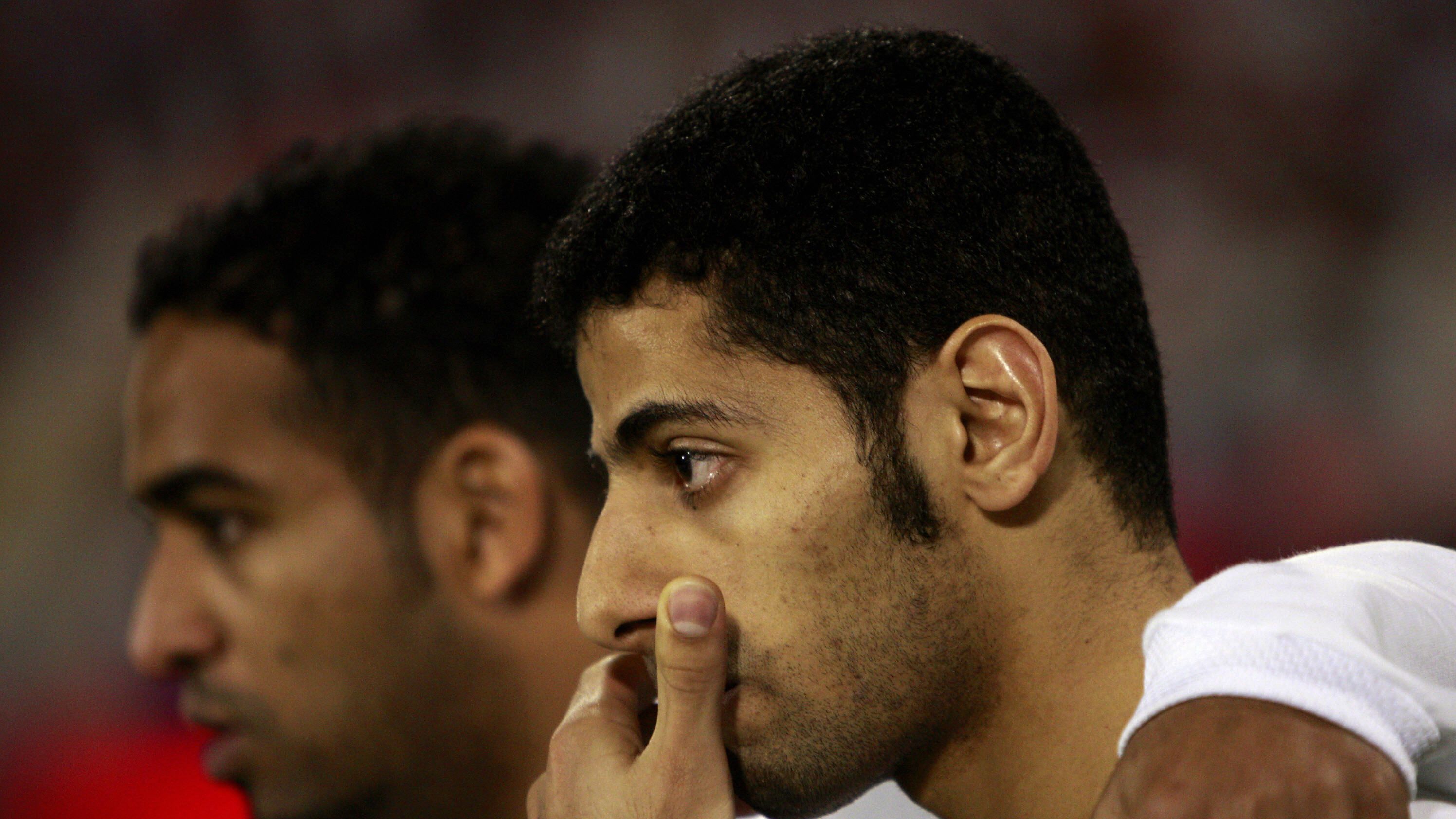 Saudi players Taisir al-Jassim (R) and A